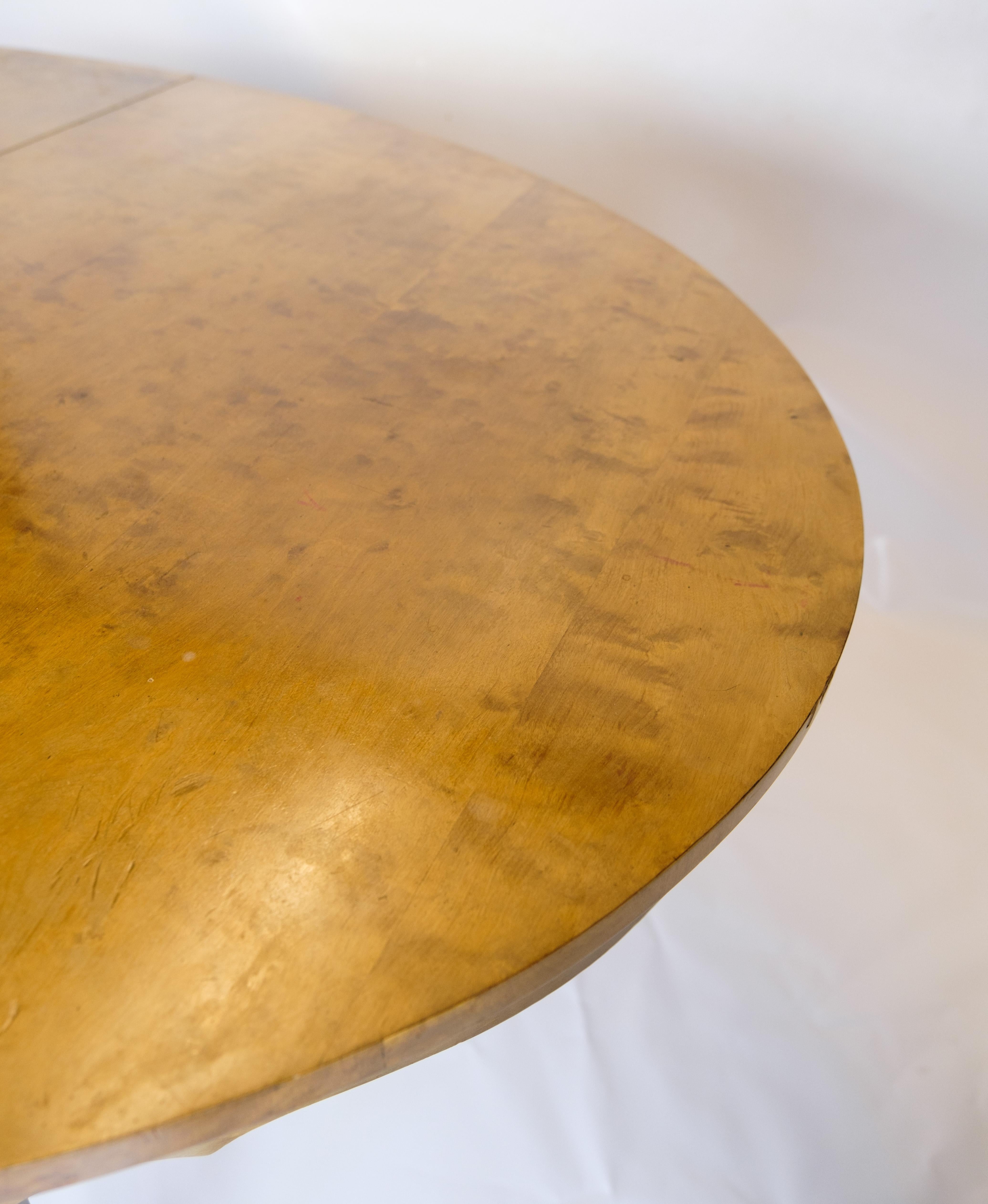 Early 20th Century Dining table with additional plates made of birch wood from around the 1920s For Sale