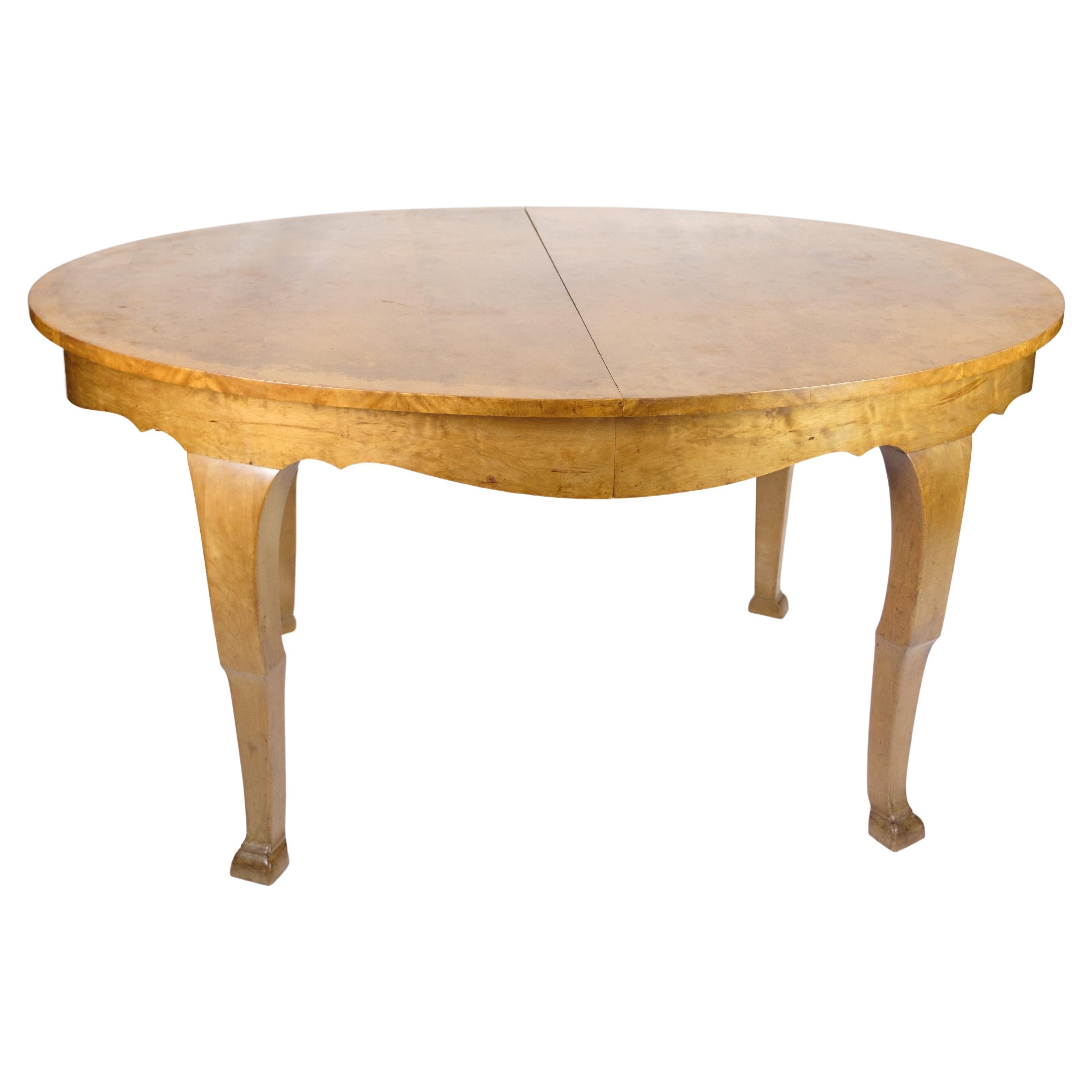 Dining table with additional plates made of birch wood from around the 1920s For Sale