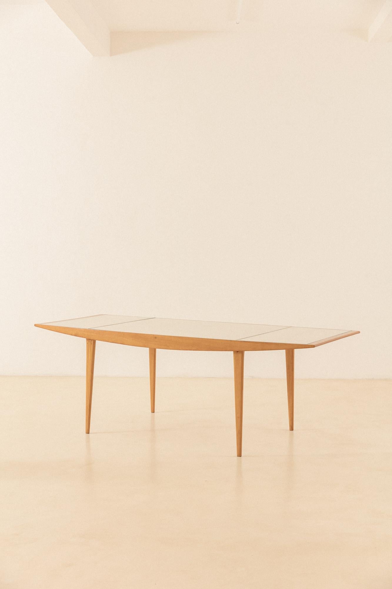 Carlo Hauner and Martin Eisler's pieces of furniture are highly designed and well-executed, with ingenious constructive details – very distinctive of any production of the time in Brazil. This dining table made of Pau-Marfim wood with Cane is an
