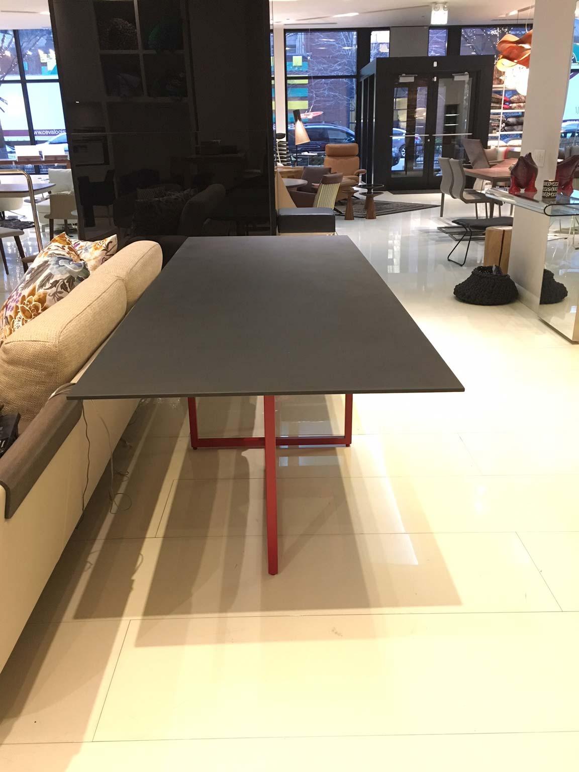 A table that plays on an apparent imbalance, supporting a strong material top, by a sequence of three structures placed in a totally unpredictable way. Built as parallelepipeds and fixed either perpendicularly or parallel to the surface, the three