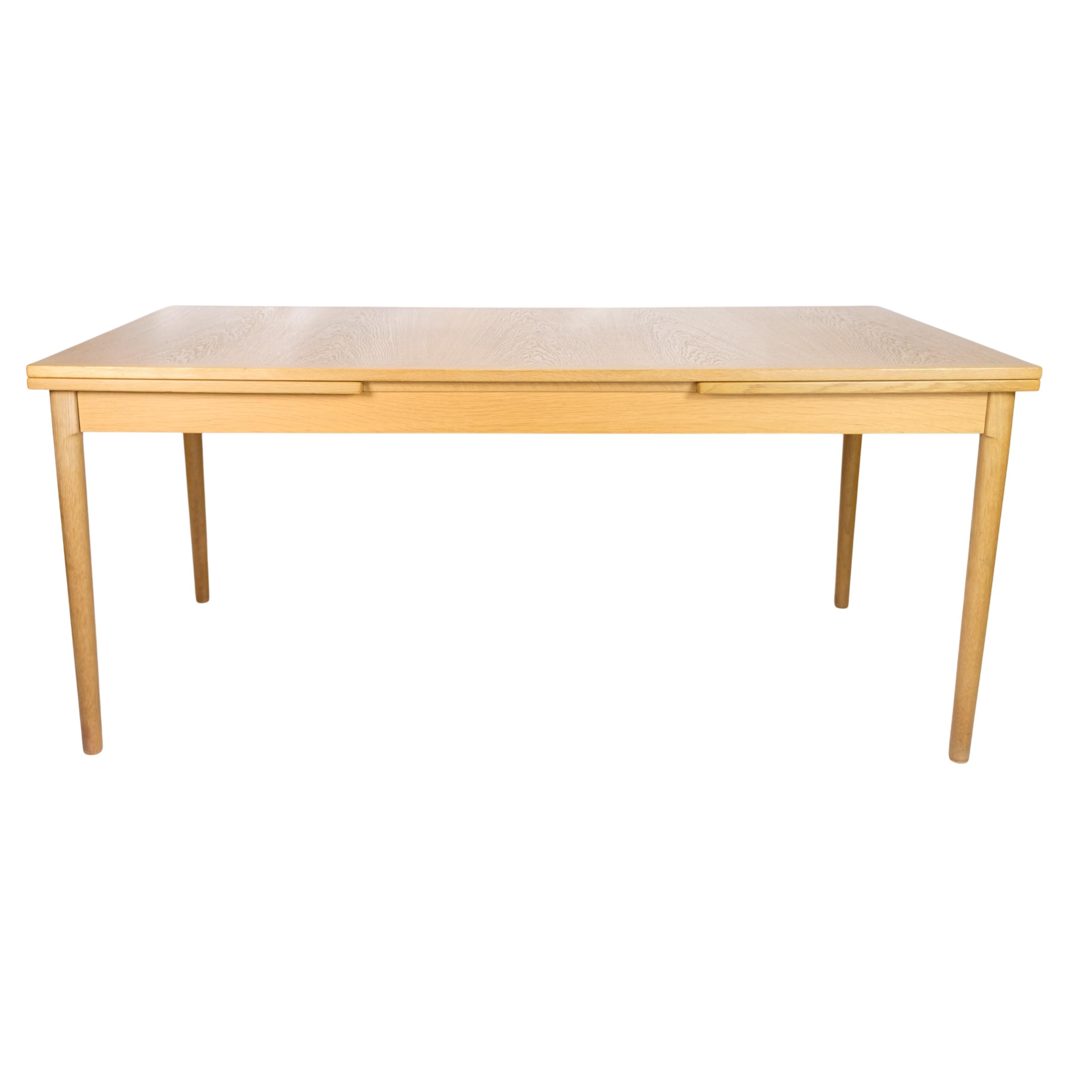 Dining table with Dutch extension, designed by Kaj Winding from the 1960s  For Sale