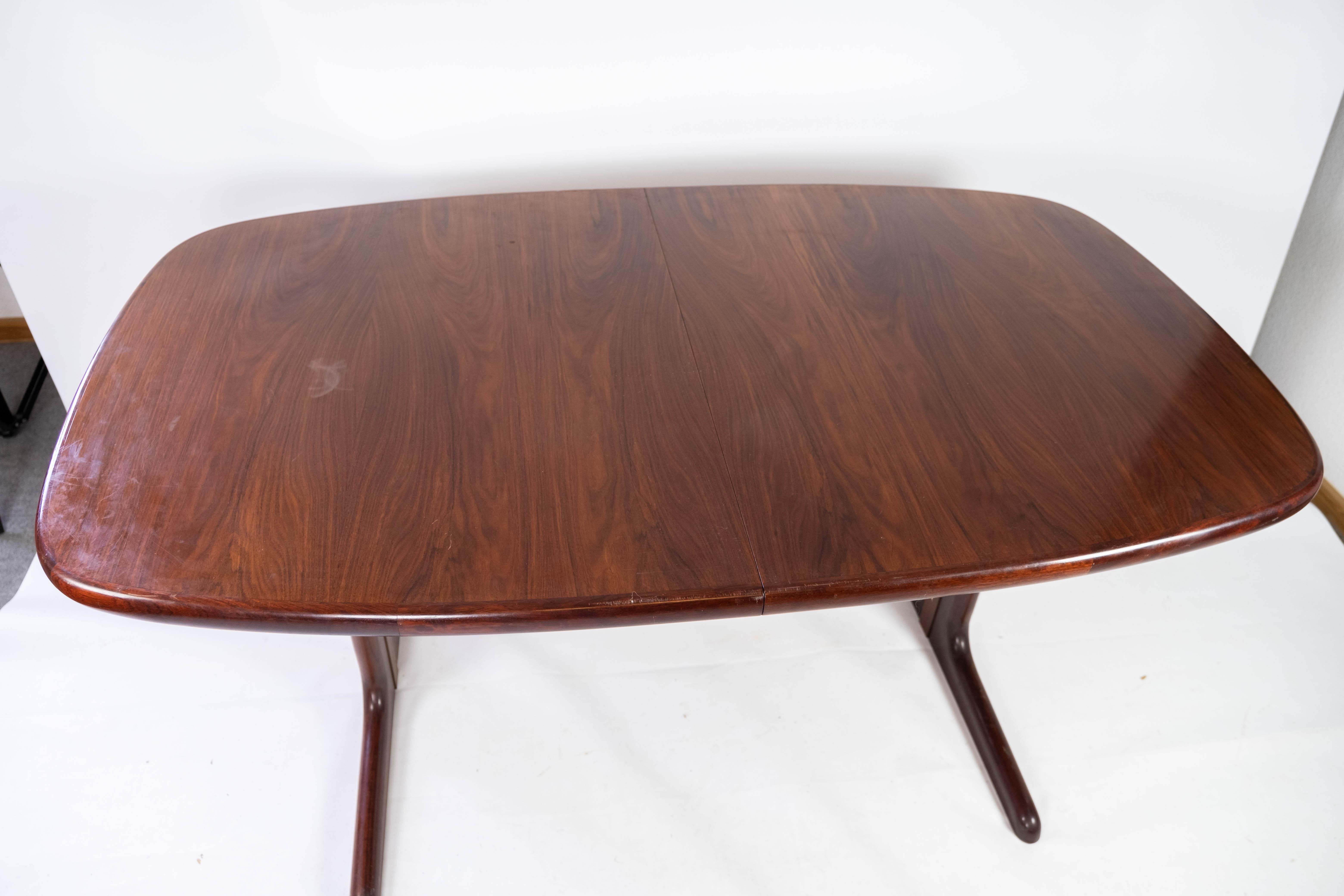 Mid-20th Century Dining Table with Extensions in Rosewood of Danish Design Manufactured by Skovby