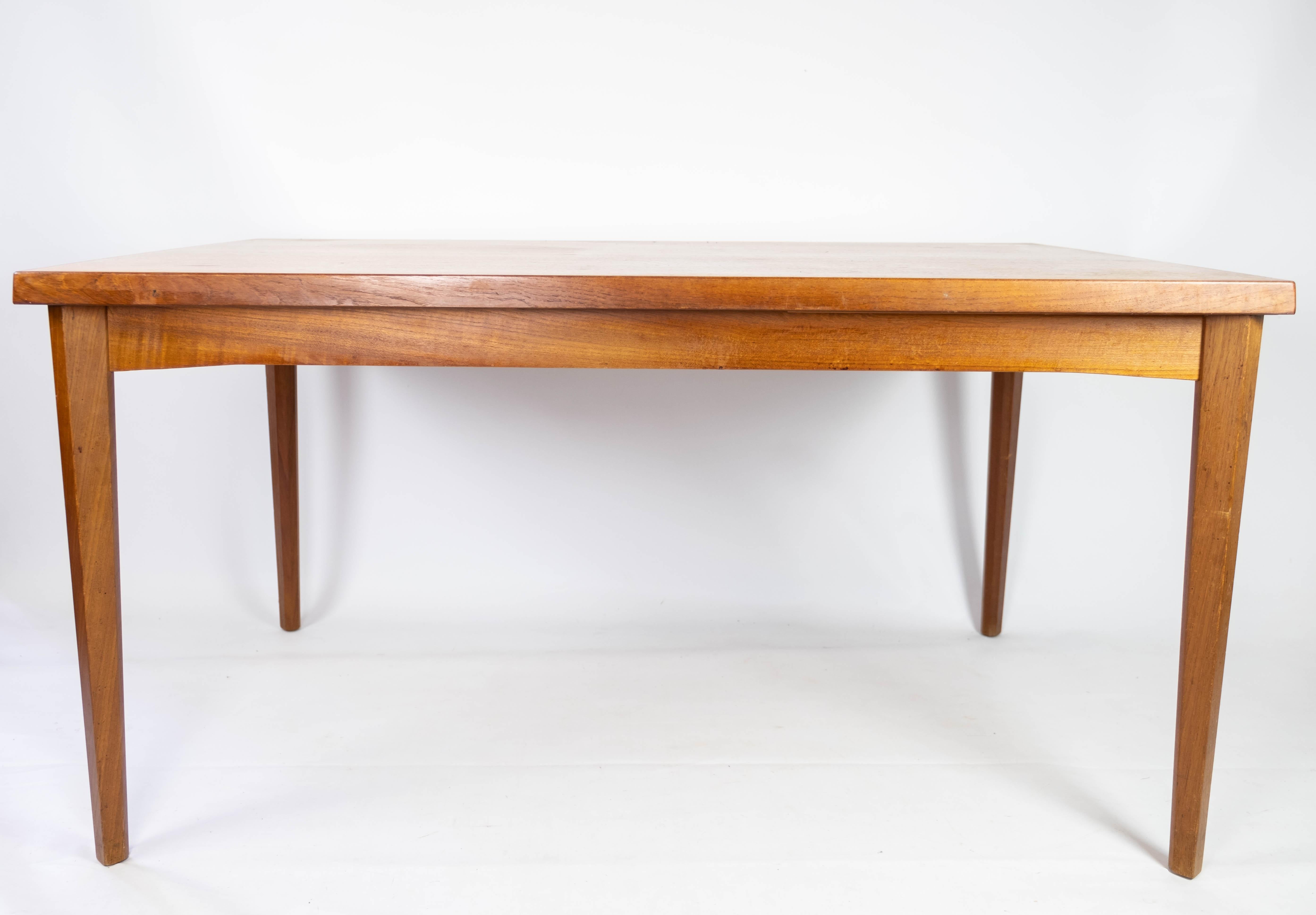 This teak dining table from the 1960s epitomizes Danish design excellence with its blend of functionality and aesthetics. Crafted with quality teak wood, it exudes warmth and durability, characteristic of mid-century Scandinavian furniture.

The
