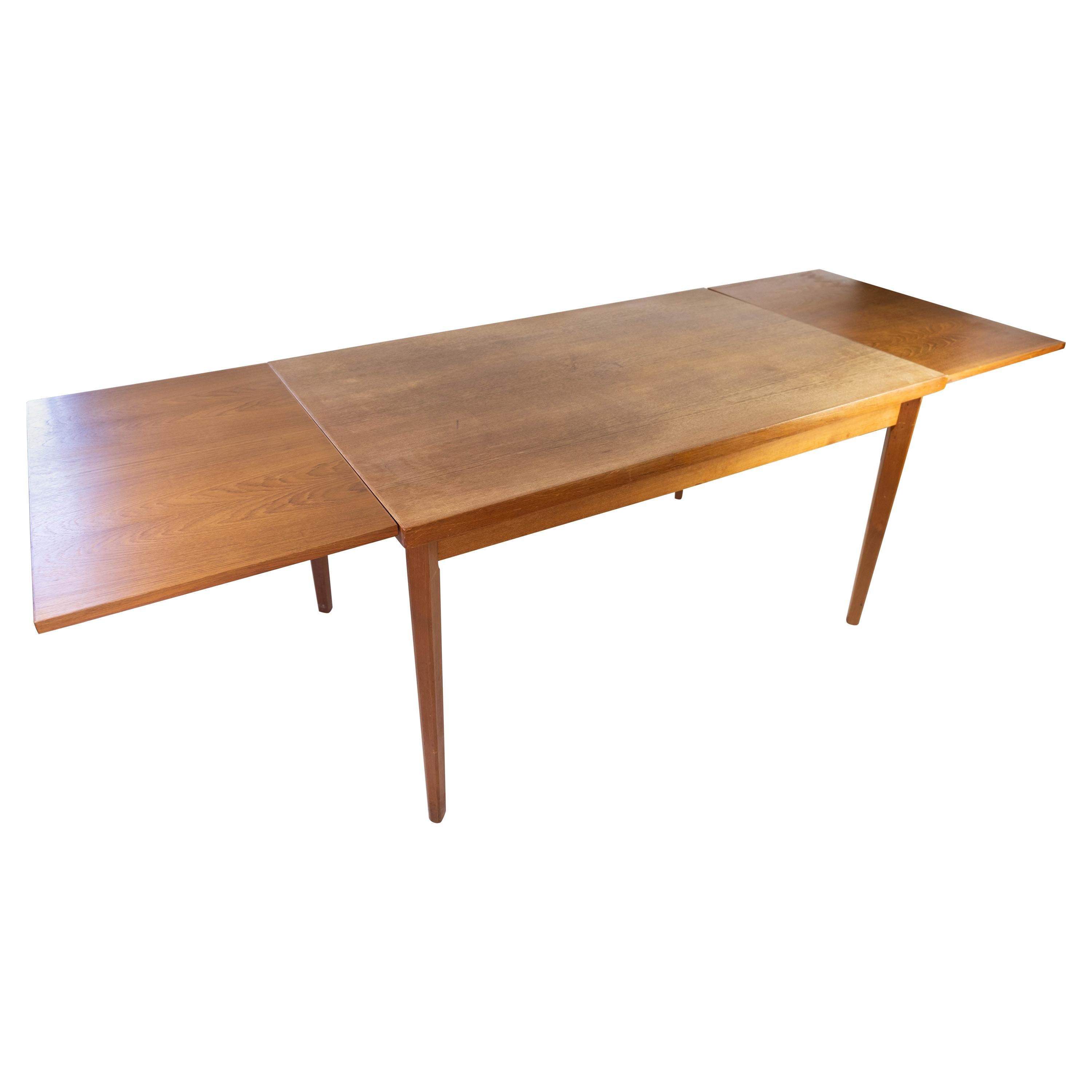 Dining Table with Extensions in Teak of Danish Design from the 1960s