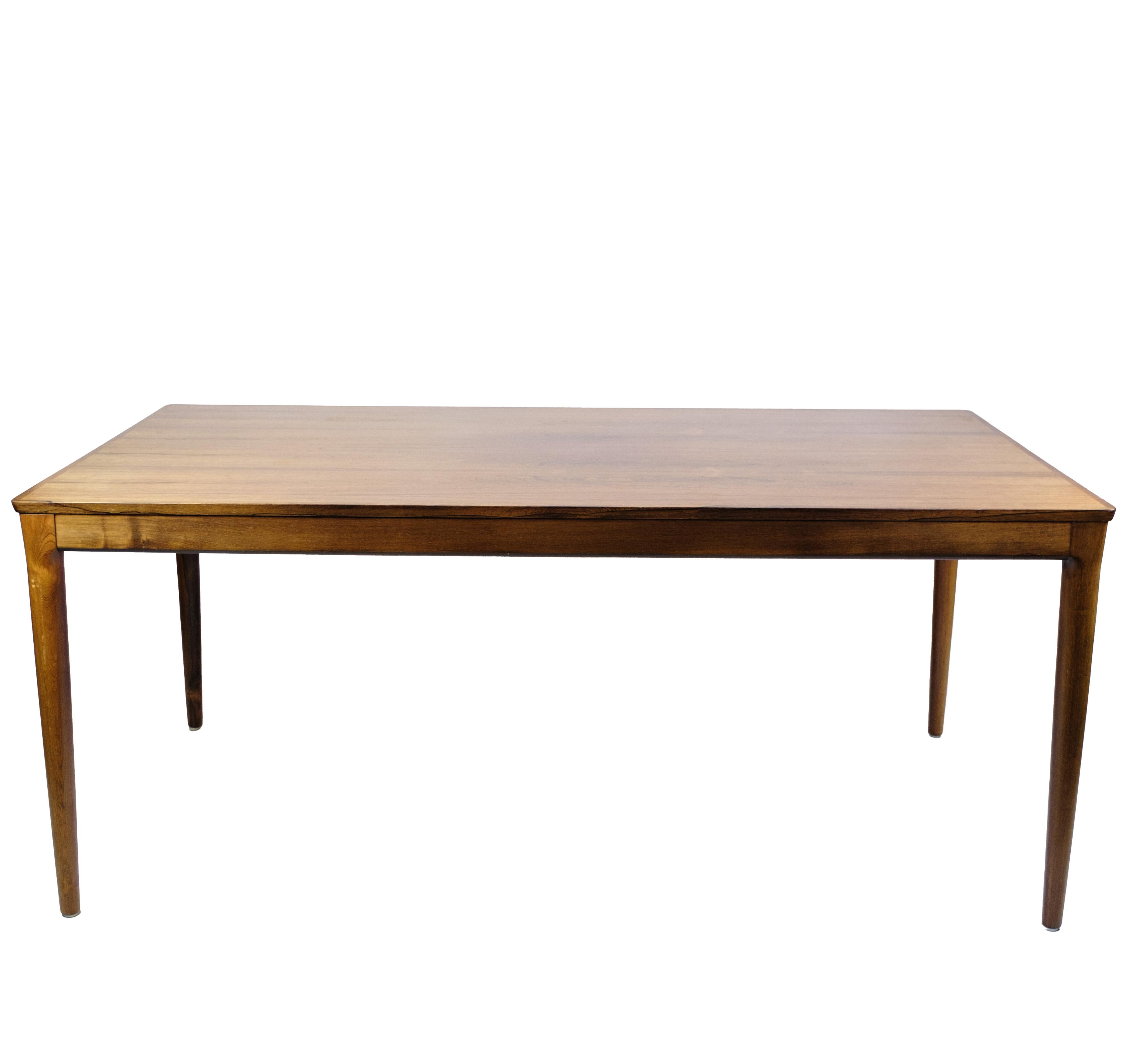 Extendable dining table, made of rosewood, manufactured by Sorø Møbelfabrik in the 1960s. The table has two extension leaves, each 52.5 cm, which provides flexible expansion options. Classic Danish design with a focus on functionality, craftsmanship