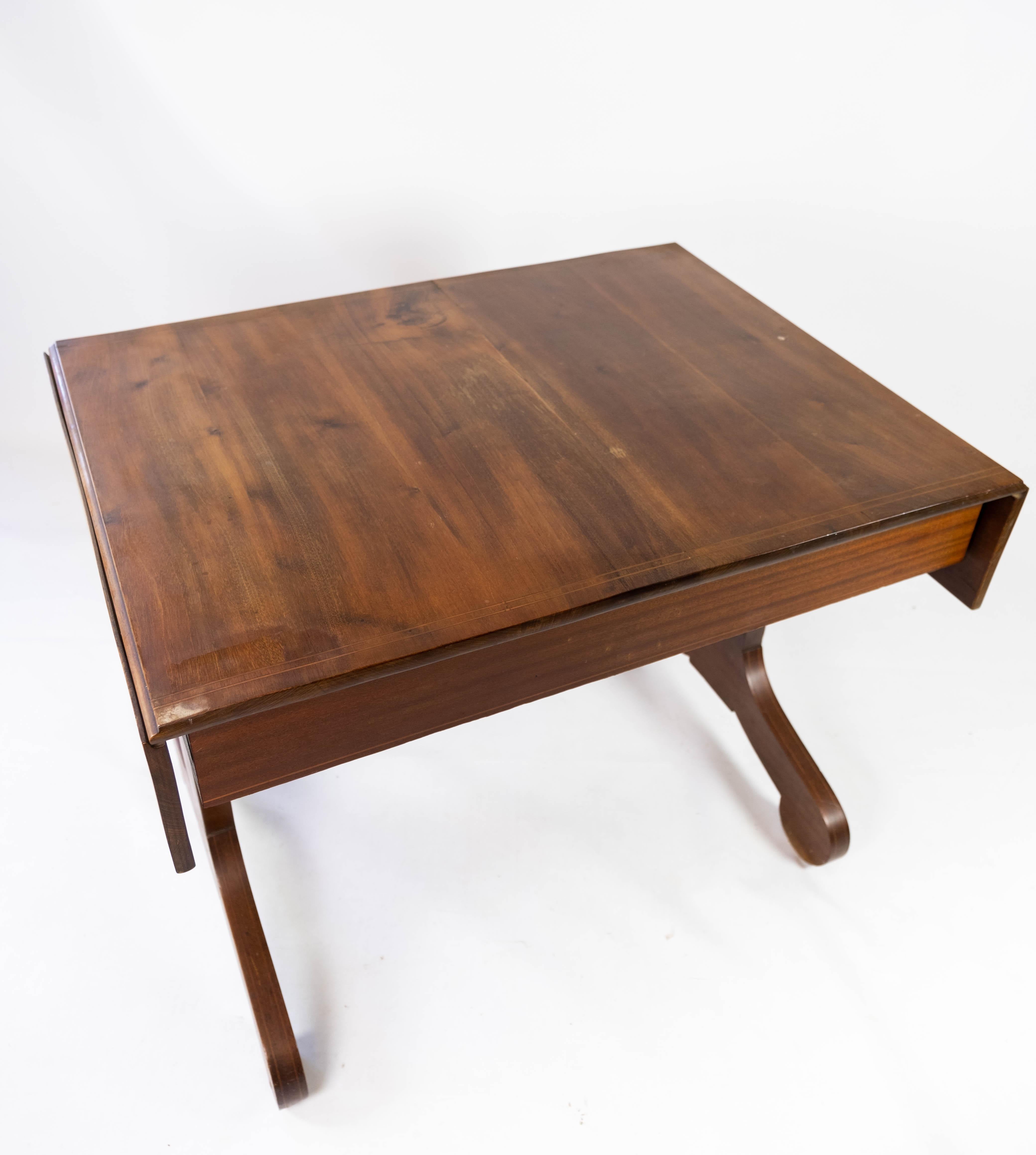 Dining table with extensions of mahogany and in great antique condition from 1860. 
Measurements of extention are 132 cm.