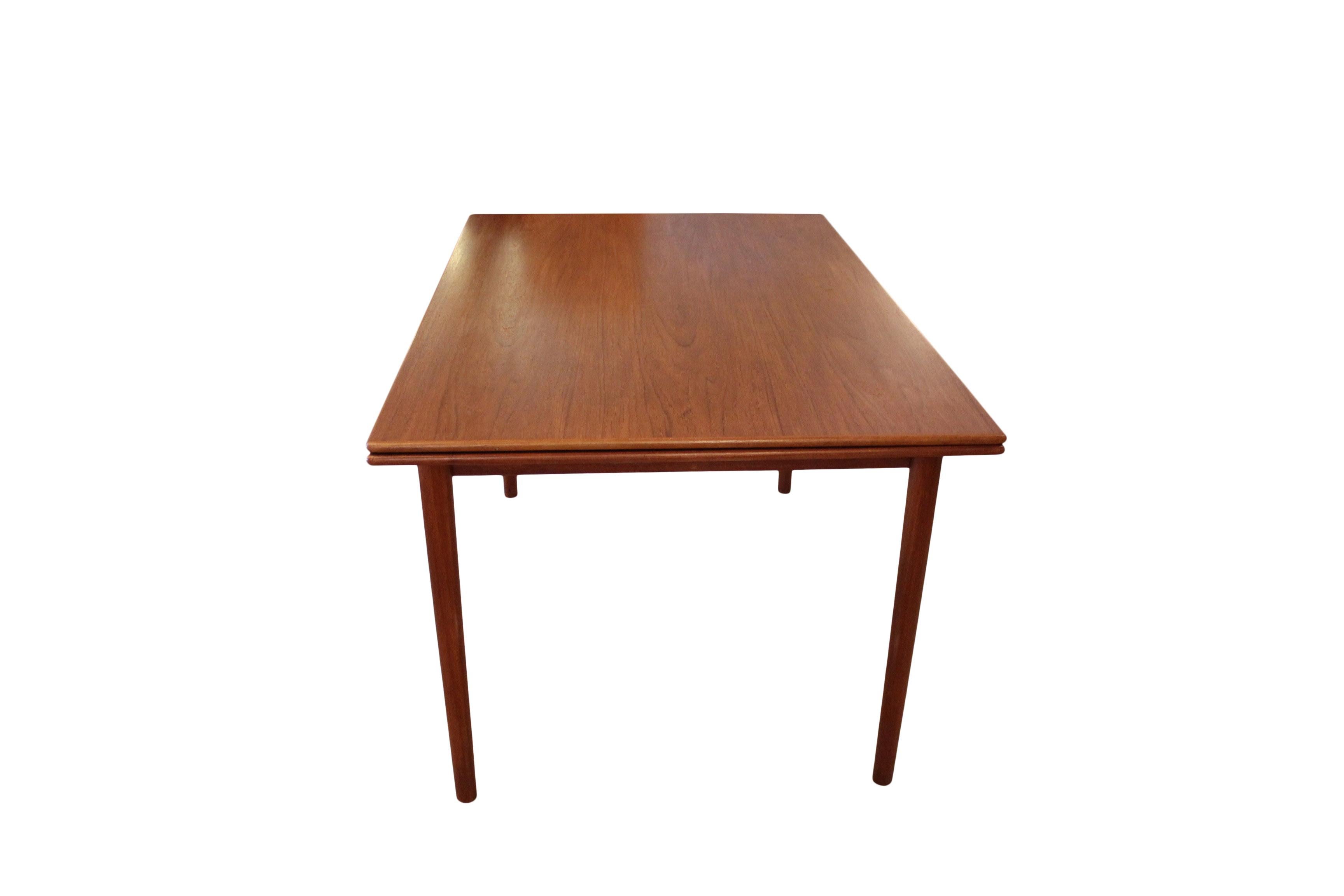 This exquisite dining table, an epitome of Danish design from the 1960s, is crafted from teak, renowned for its rich grain and durability. Its sleek and elegant design is characterized by clean lines and minimalist aesthetics, typical of the