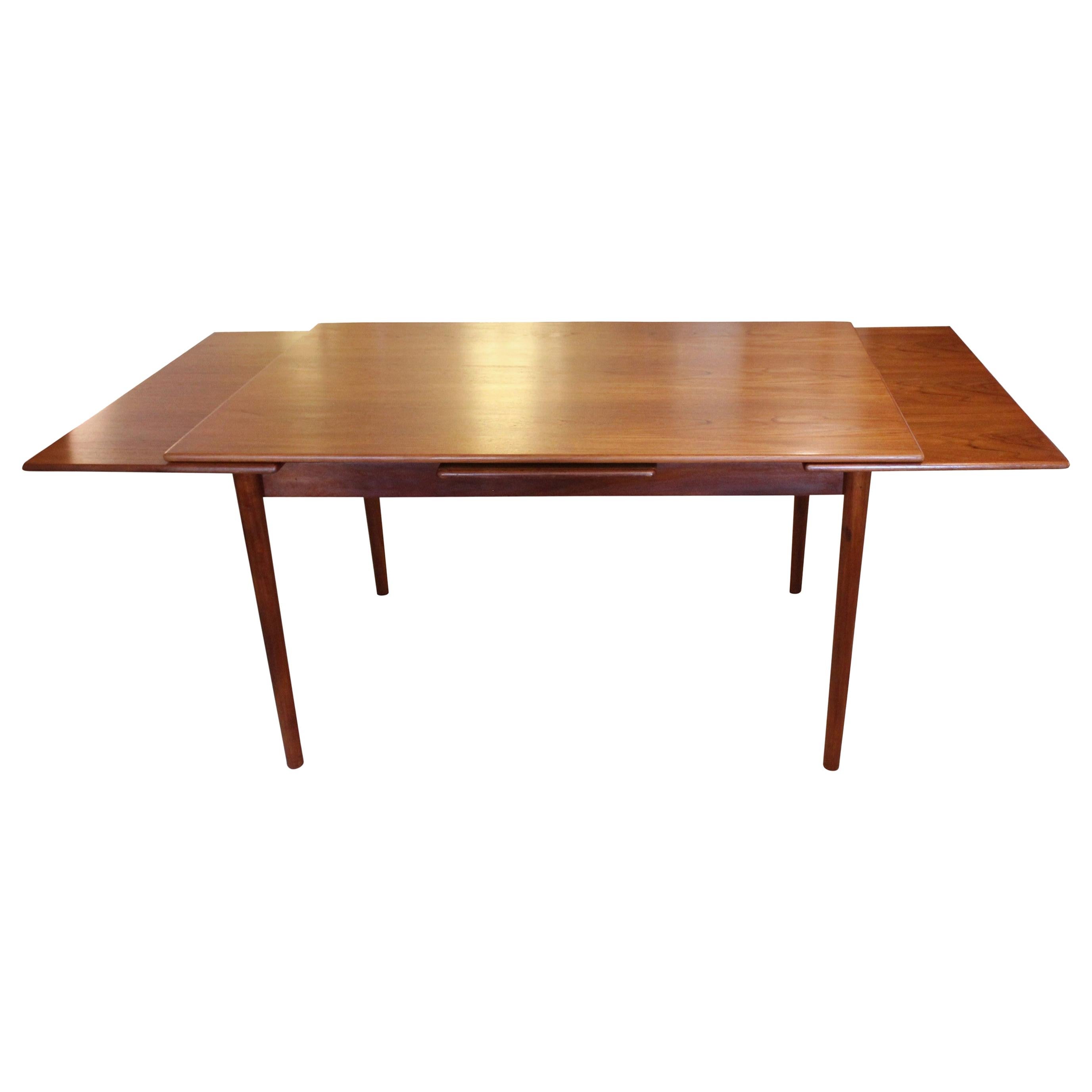 Dining Table with Extentions in Teak of Danish Design from the 1960s For Sale