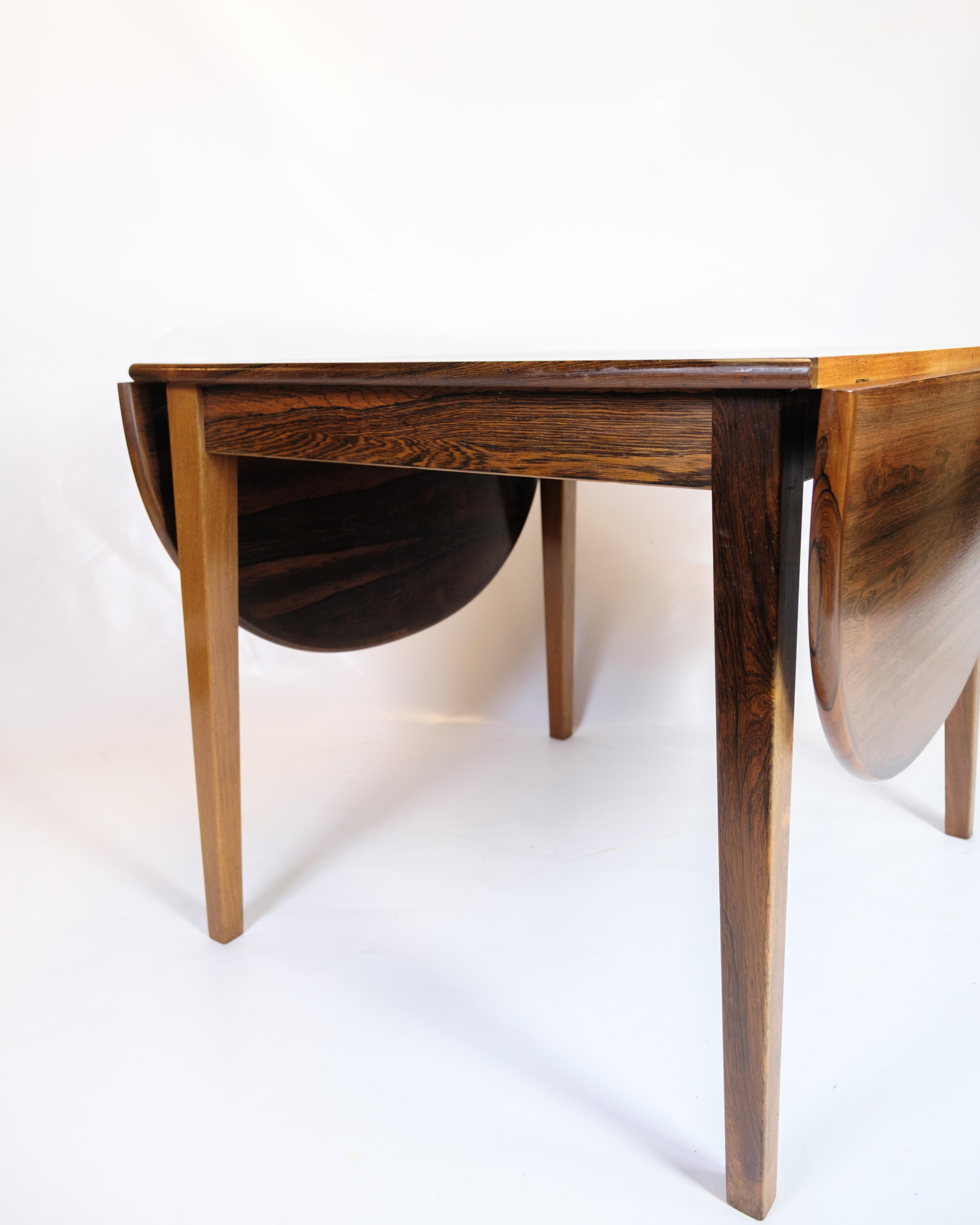 Mid-20th Century Dining Table With Flaps Made In Rosewood, Danish Design From 1960s For Sale