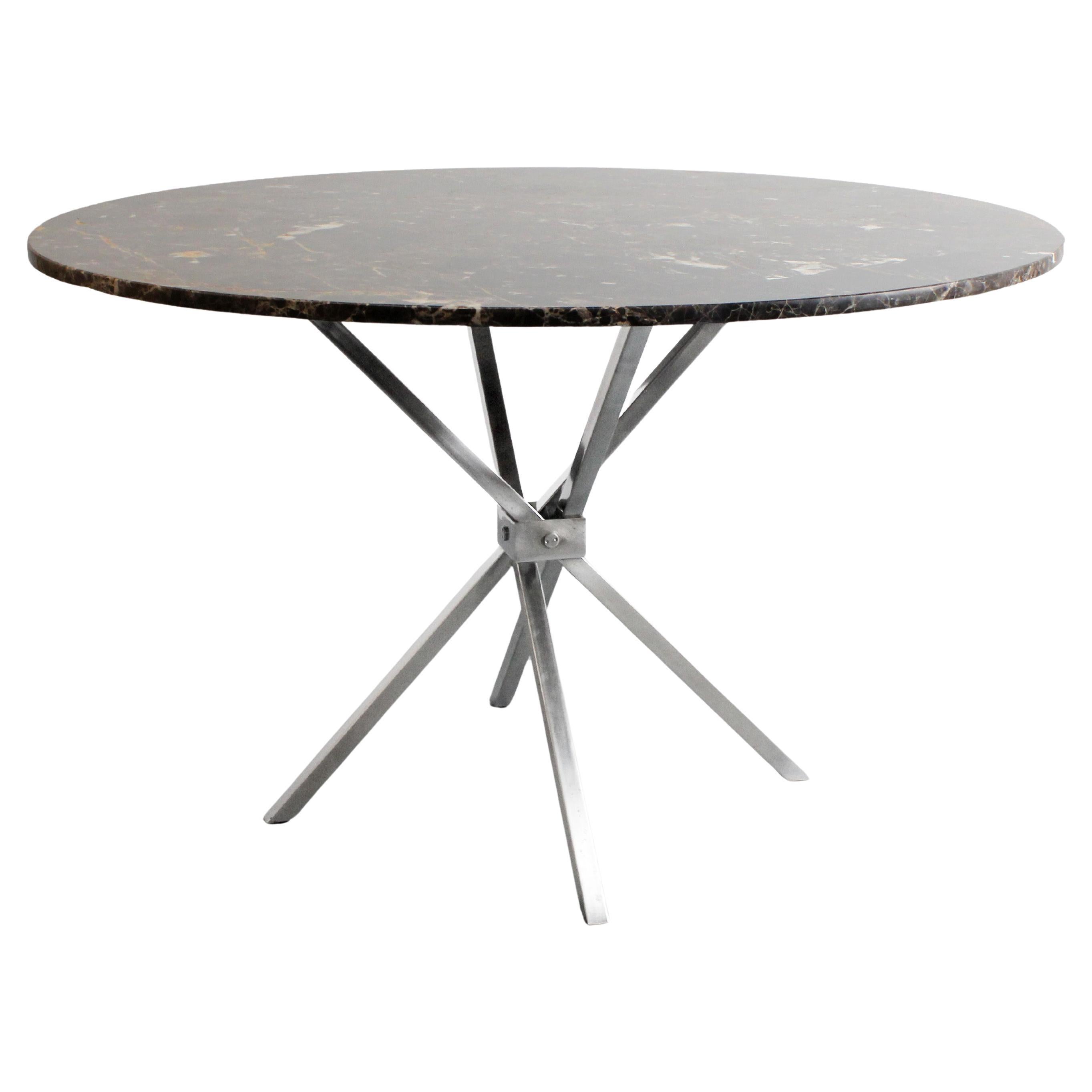 Dining table with folding chrome-plated metal scissor legs and Emperador marble