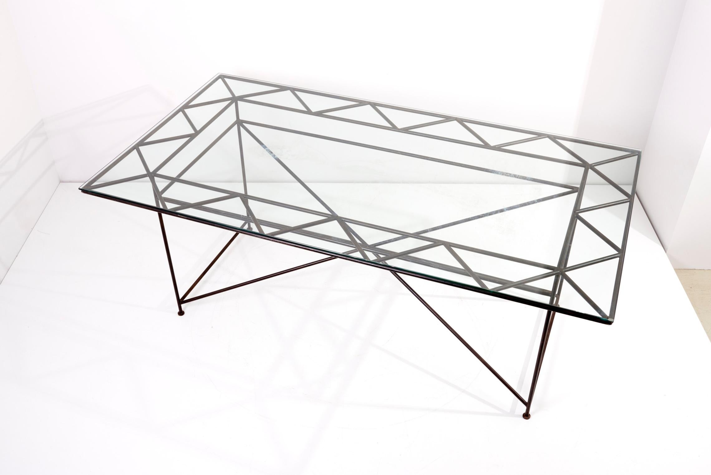 Dining table in iron with glass top by Giovanni Ferrabini, 1970s.