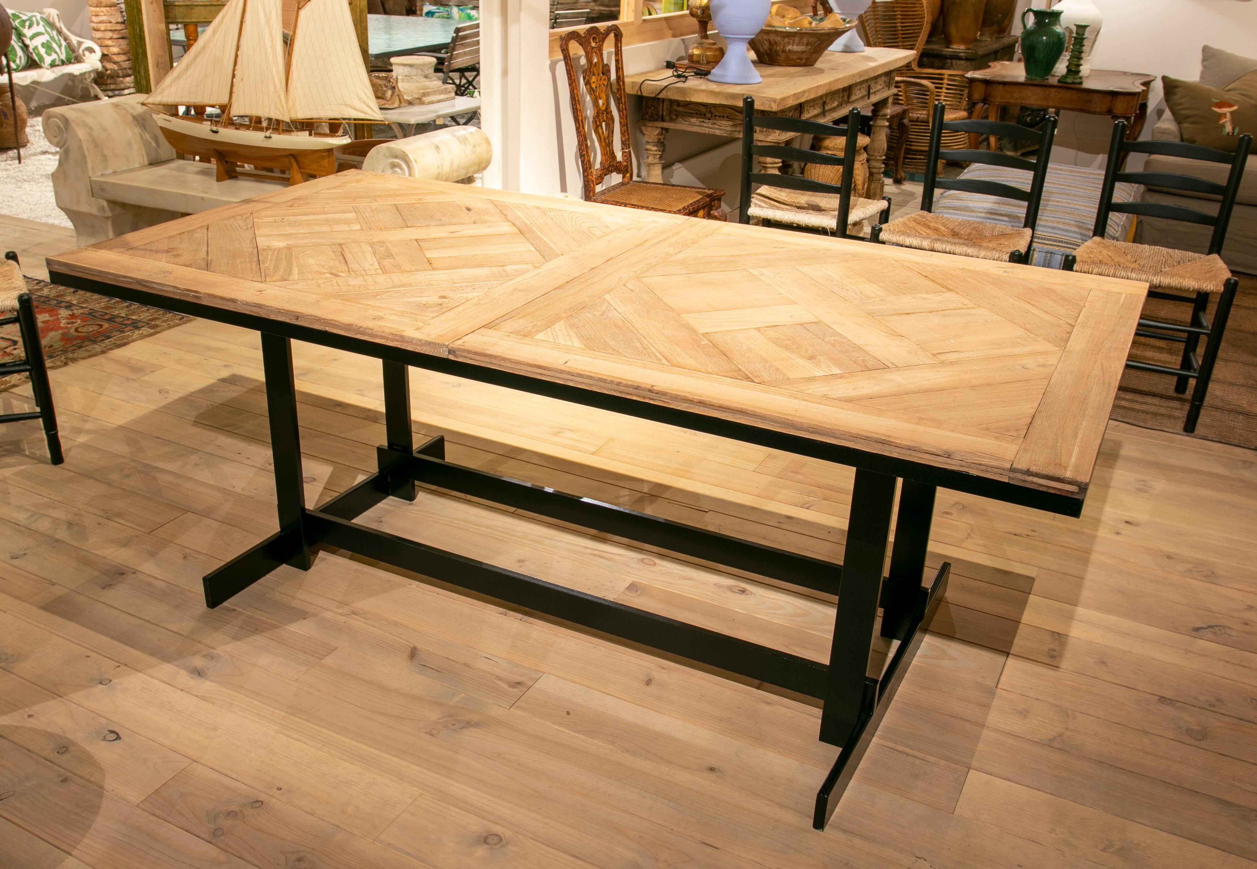 Dining Table with iron base and elm floor table top.