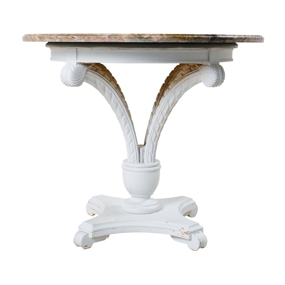 This dining Table includes a marble top and painted carved base.