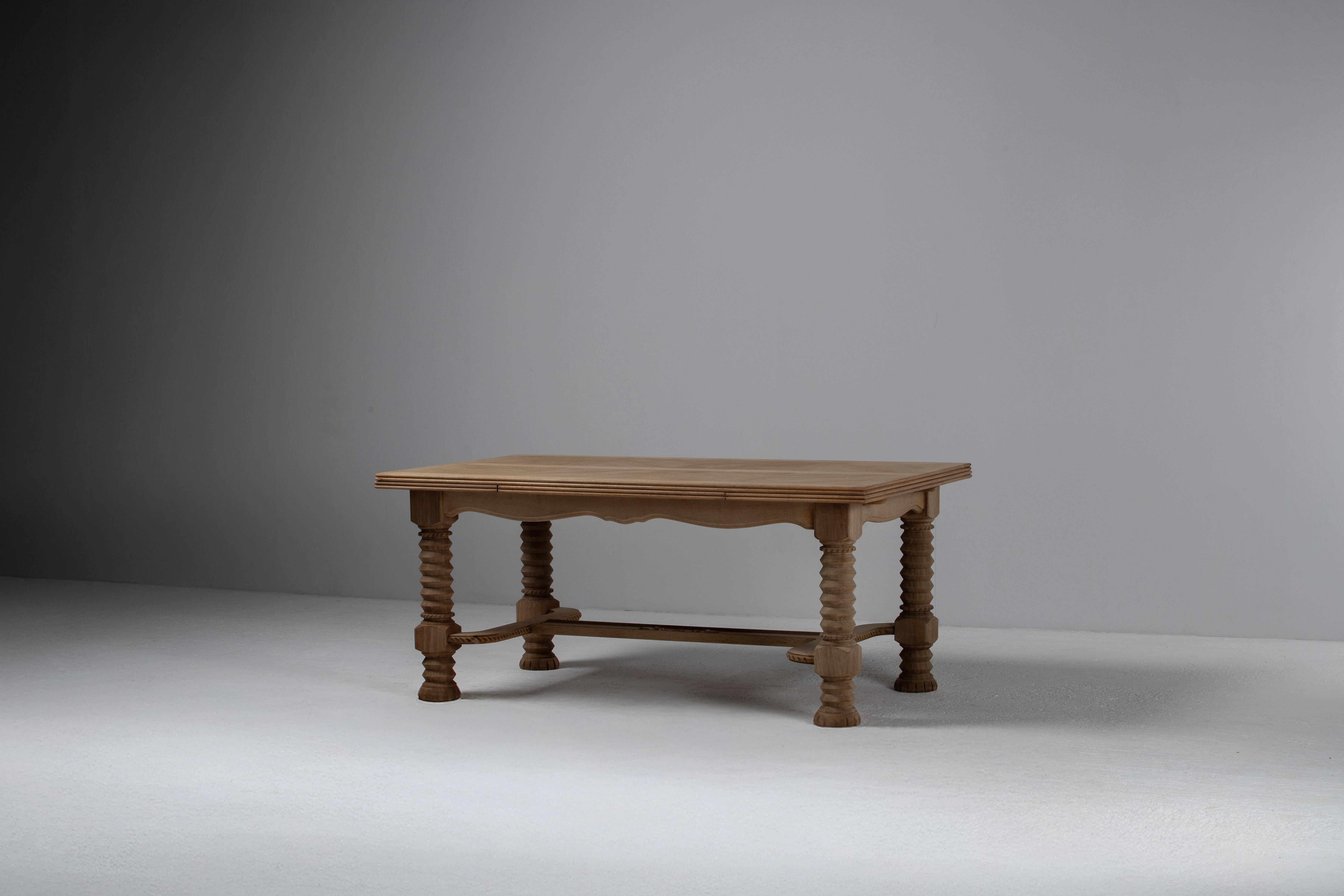 Dining Table with “Presse à Vin” Legs, Bleached Oak, France, 1940s
French Provincial Style

With its monumental spiraled legs and deeply carved stretcher, this French oak table pays homage to the agricultural architecture of 19th-century wine