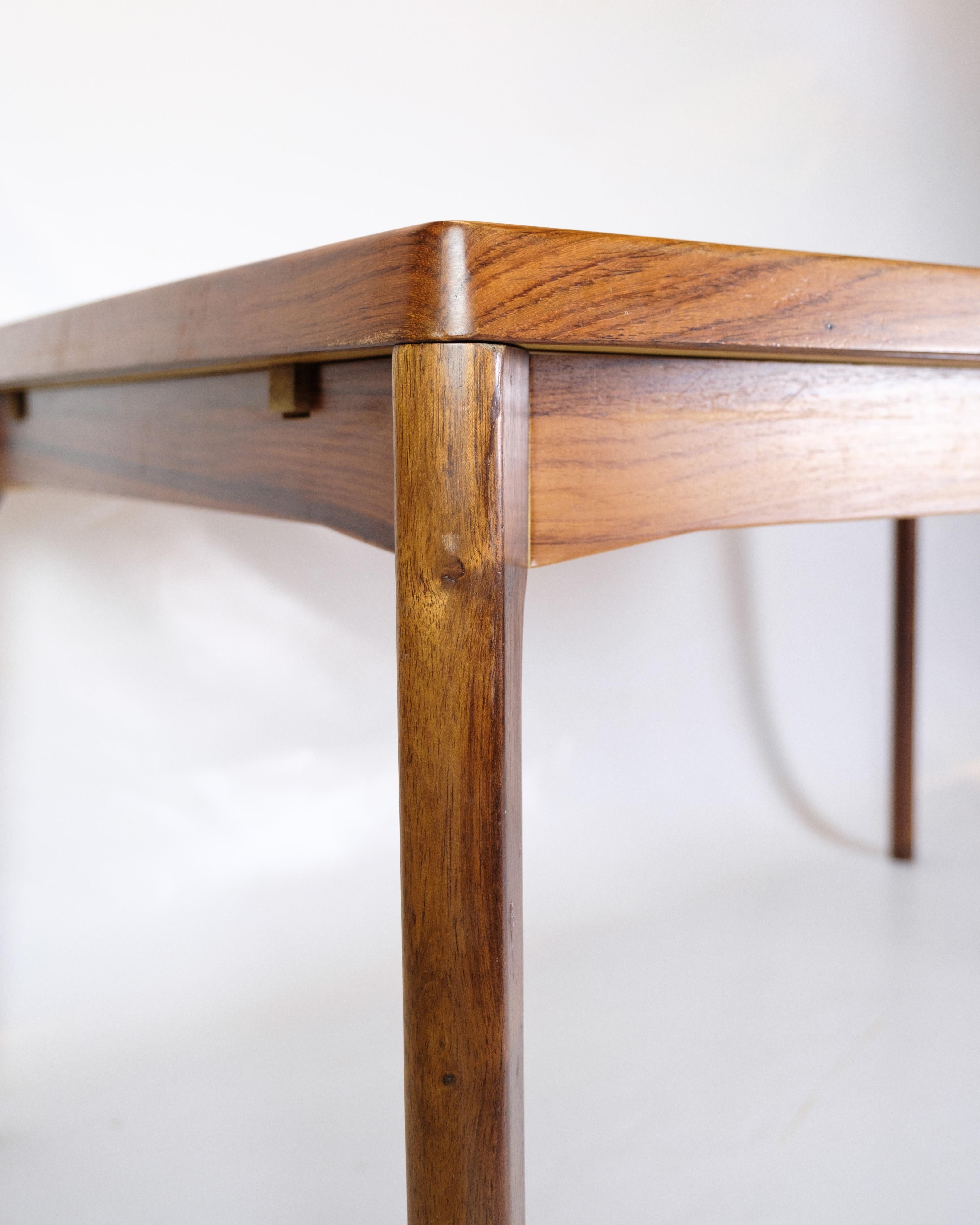 Mesa de comedor extraíble de madera de palisandro por Henning Kjærnulf De los años 60 Danés en venta