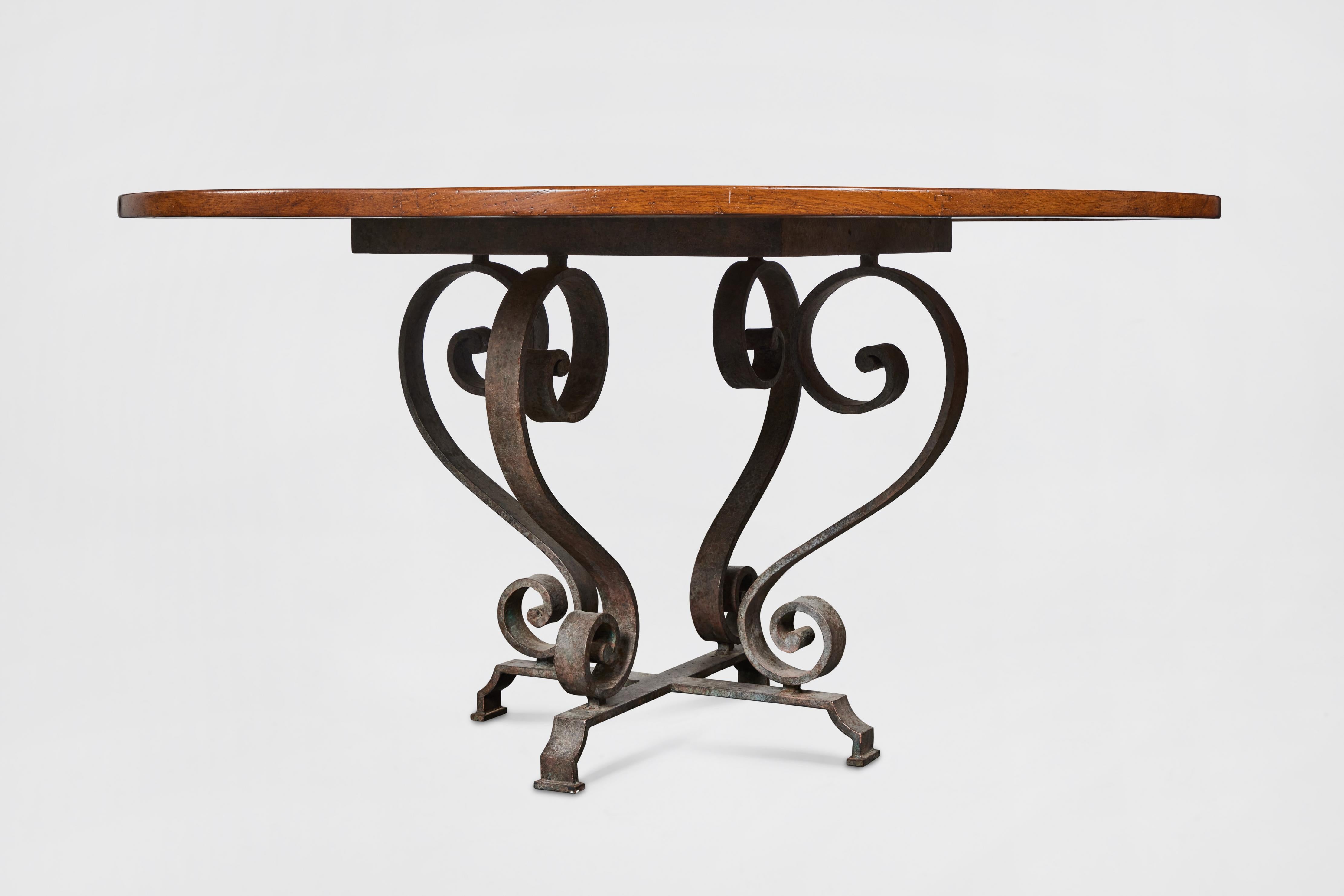 American Dining Table with Round Mahogany Top and Wrought Iron Base For Sale