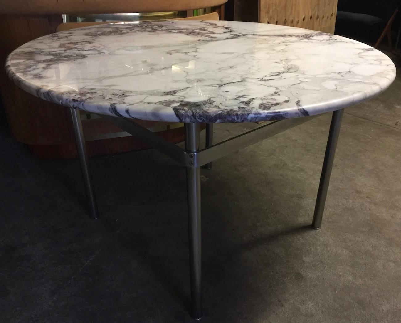 Has also laverne elements heavy marble base with wonderful grain resting on a matte chromed metal base.