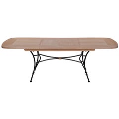Wrought-iron table with solid oak top and extensions