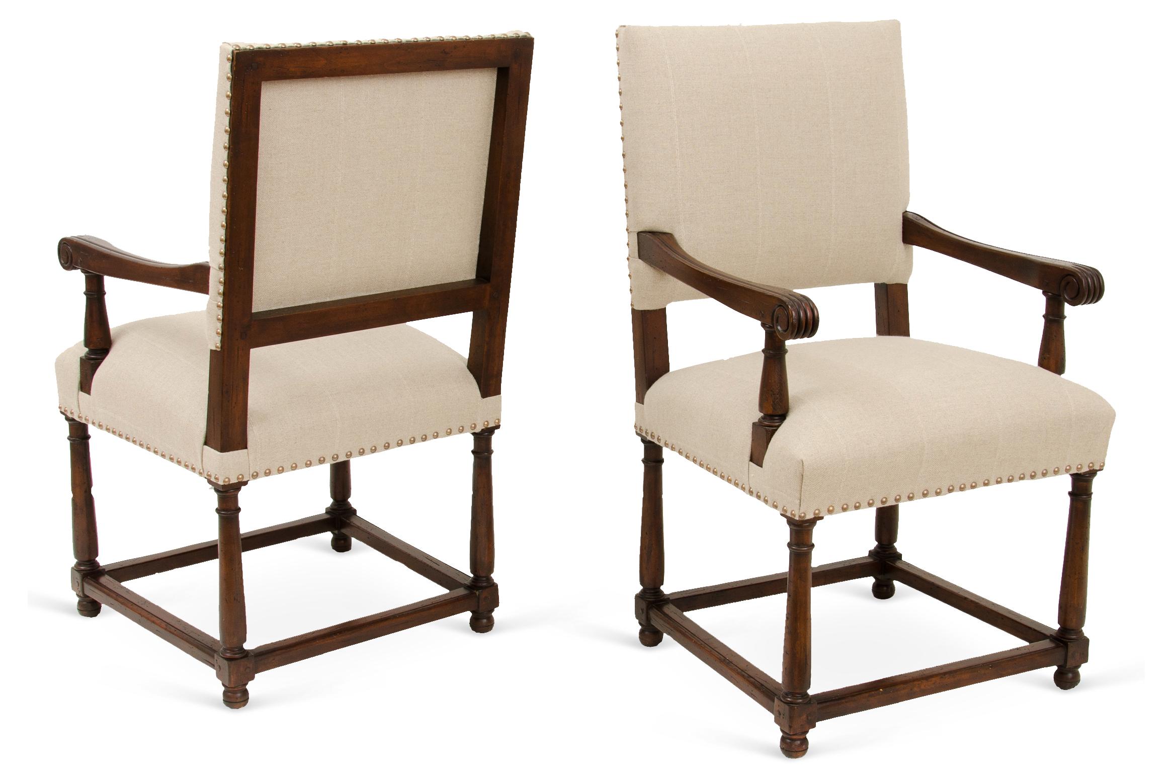 This hand-crafted armchair is an XVIII century reproduction with hand-turned legs, traditional joinery,
and an antiqued walnut finish. Custom sizes and finishes available. 

 
