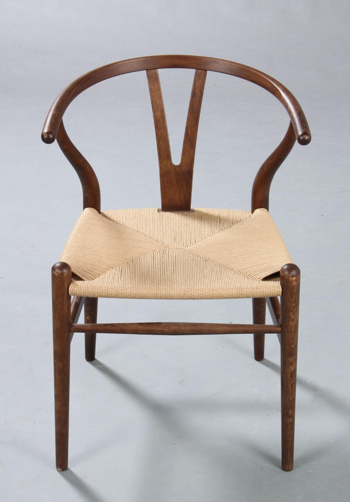Hans J Wegner (1914-2007). Bog oak Y-chair, model CH 24, seat woven with paper yarn, manufactured by Carl Hansen & Søn. H. 76 cm. Seat height 45 cm. Some markings.