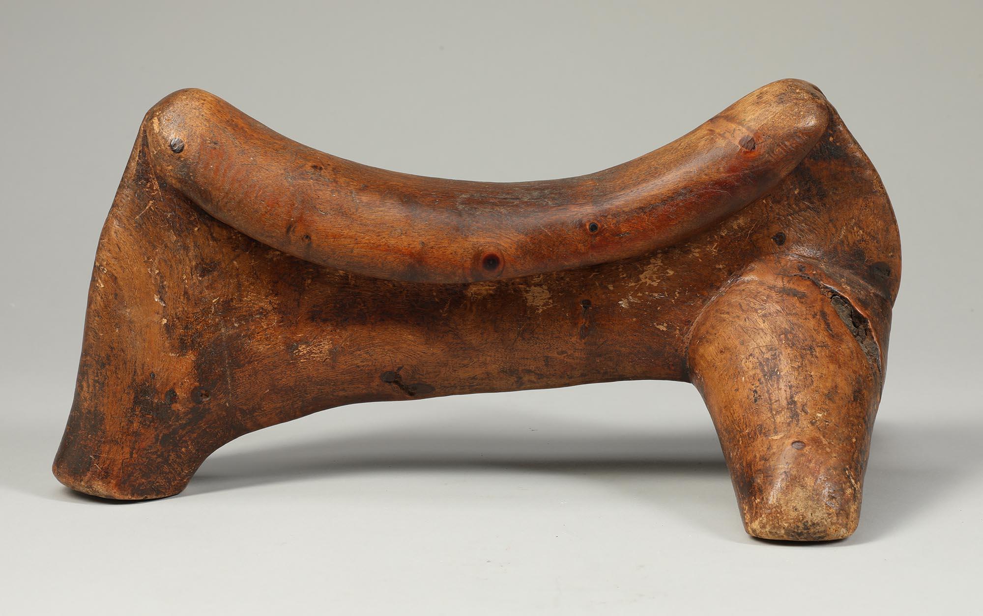 Tribal Dinka stylized animal form carved wood headrest, East Africa