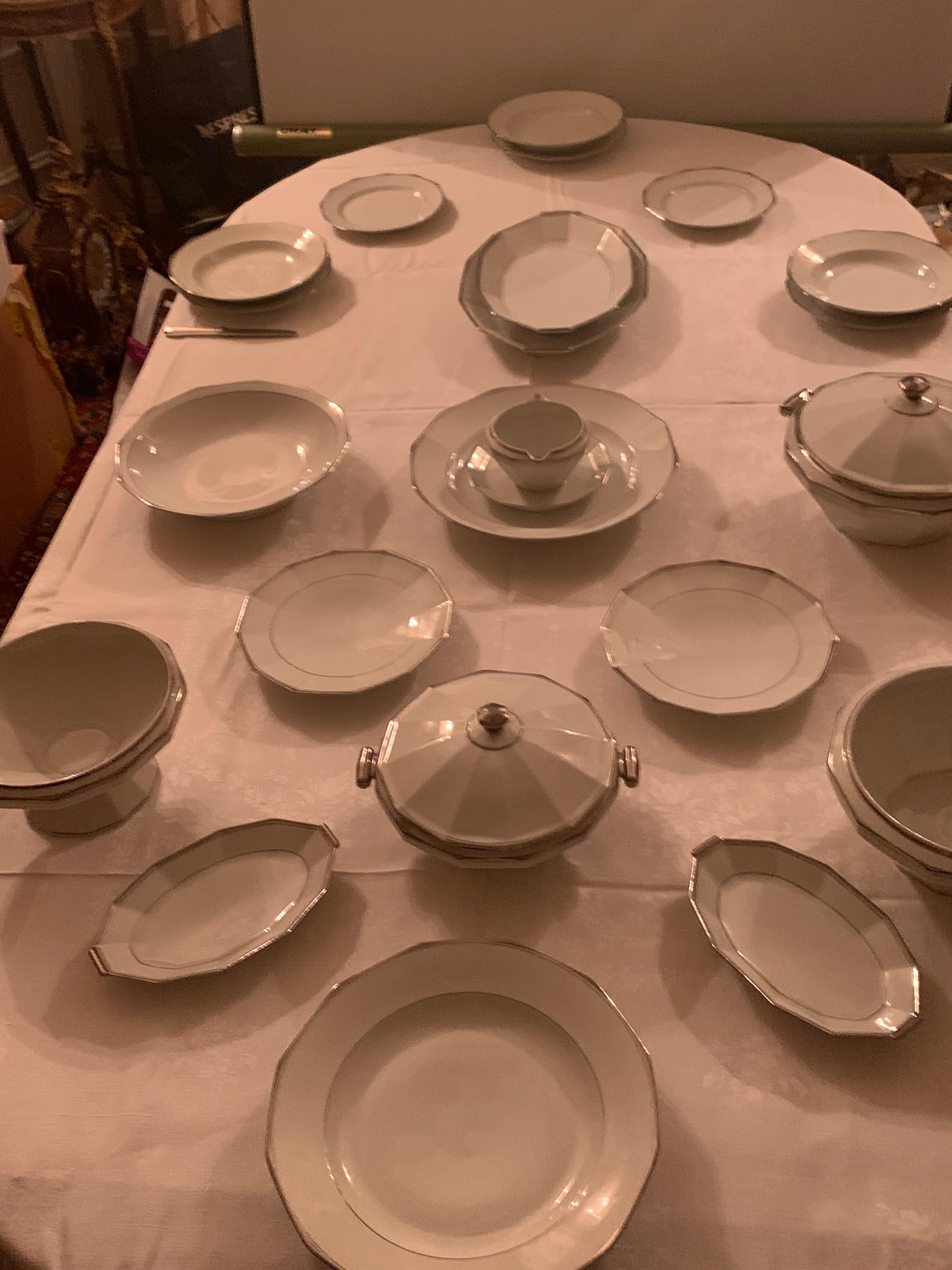 Very beatifull Limoges porcelain dinner set in the modern style comprising 73
pieces,it is a dinner set for 12 peoples ,all the plates , dishes,and shapes pieces are all decorated with a silver-colored border 
12 soup plates ,12 dessert plates, 36