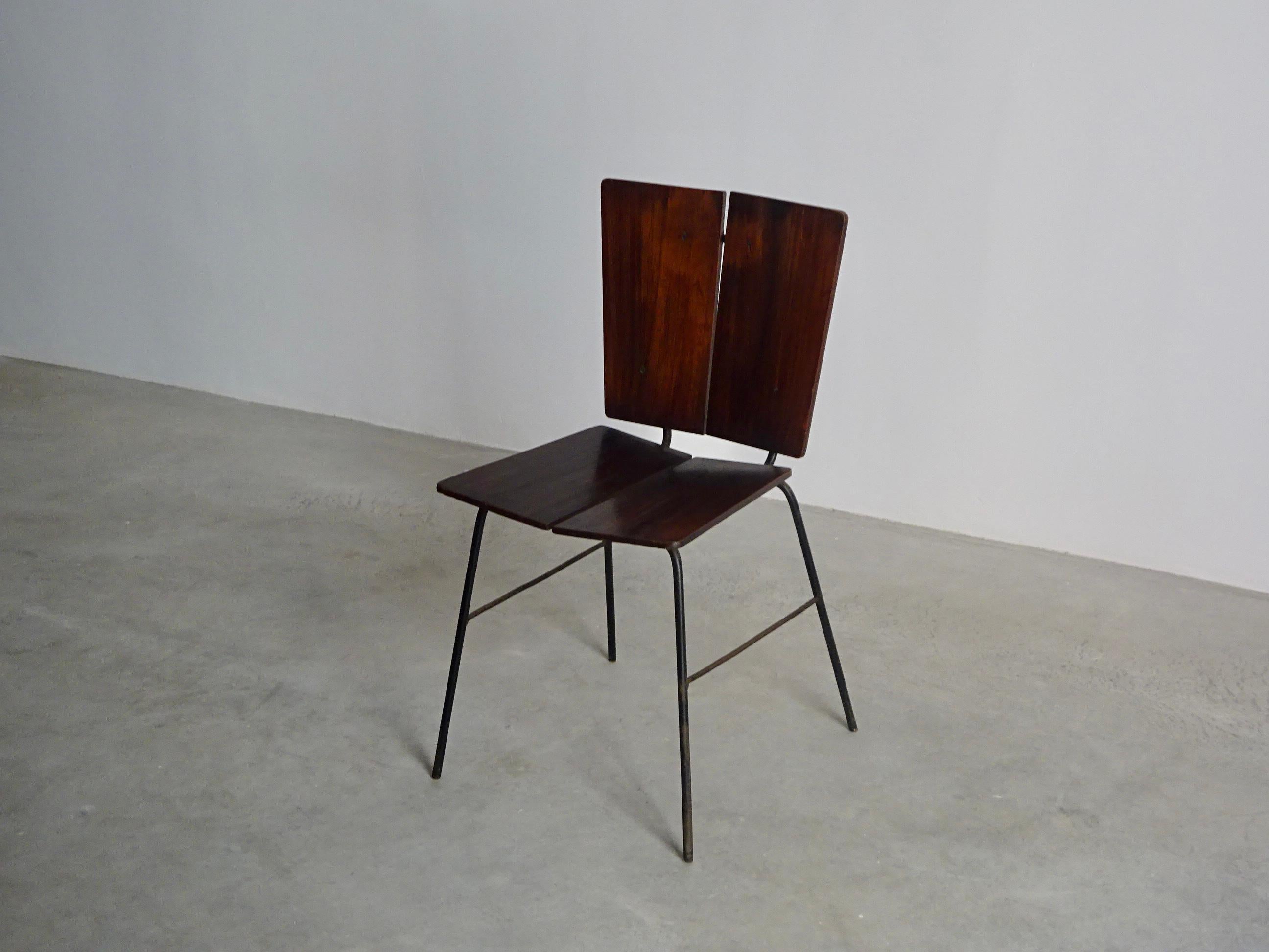 Dinning chair in solid iron and plywood produced by Italma in 1960s.