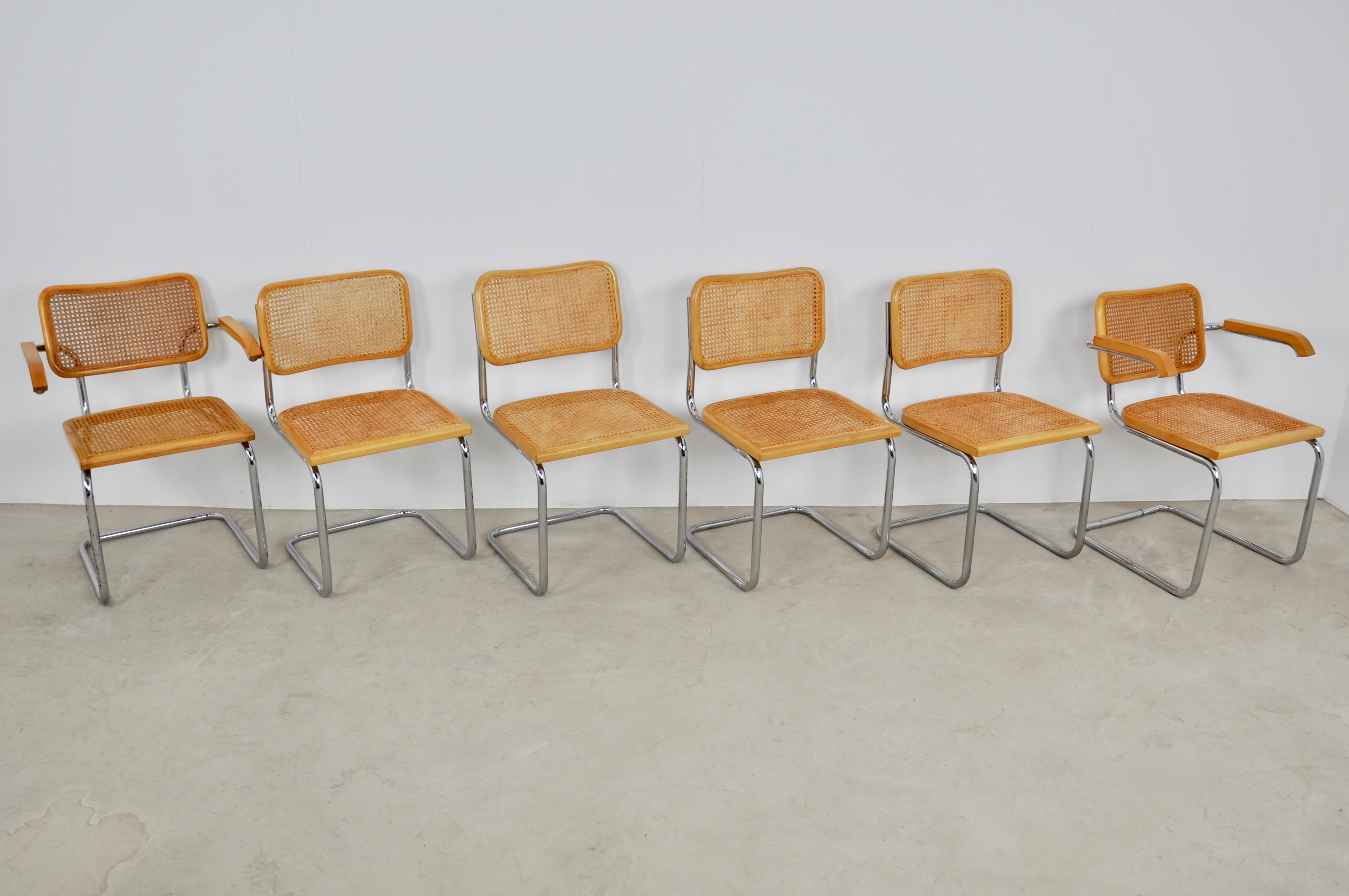 Set of 6 chairs in metal and wood wickerwork. Slight wear due to the time and the age of the chairs.
Dimensions: Chair H 82cm, W 47cm, D 51 cm, armchair H 82 cm, L 61 cm, D 57 cm, seat height 45 cm.