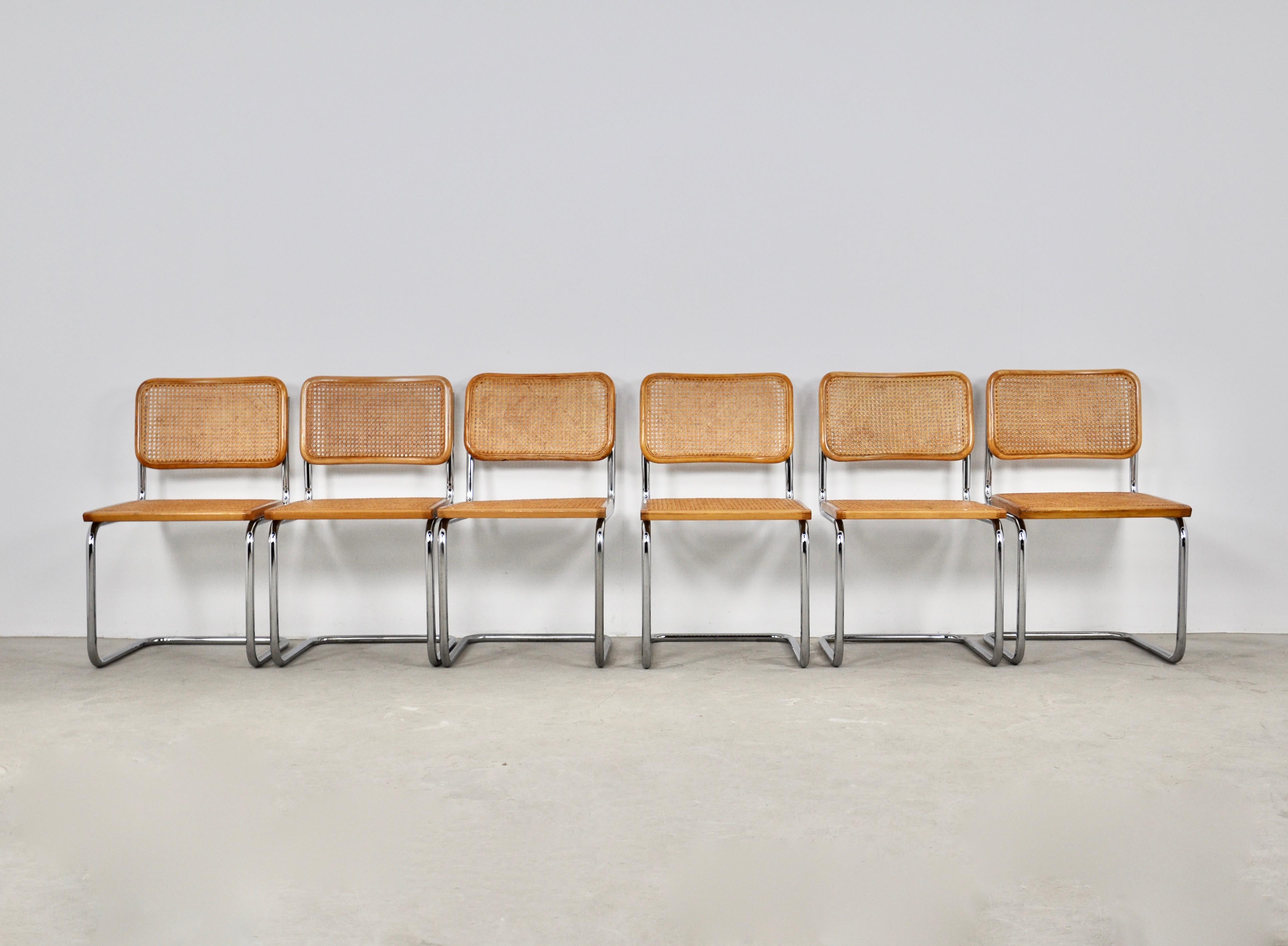 Set of 6 chairs in metal, wood and cane. Wear due to time and age of the chairs (see photo) 
Measure: Seat height: 45cm.