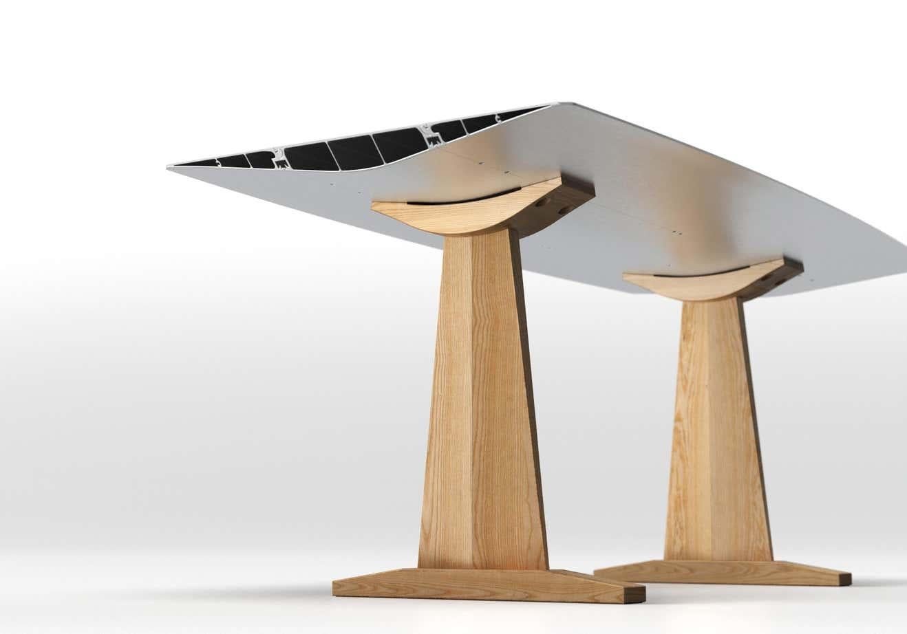 Dinning Table B90cm Anodized Silver Top With Wood Trestle Legs

Materials: 
Aluminium, oak, ash
Dimensions: 
D 90 cm x W 240 cm x H 73 cm

The Table B, which inaugurated the Extrusions Collection in 2009, can reach up to five metres using a simple