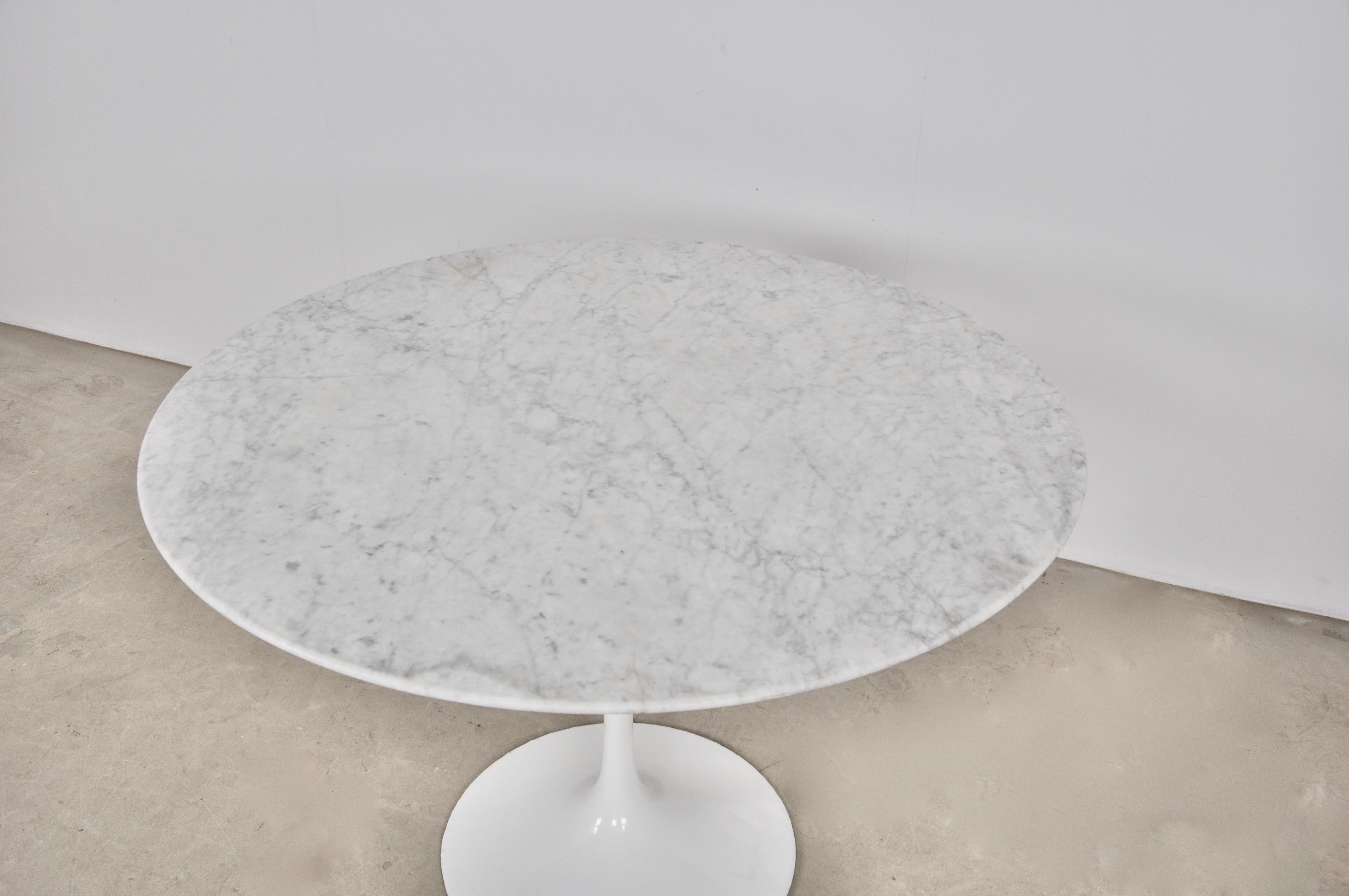 Carrara marble table. Foot stamped Knoll. Wear due to time and age of the table.