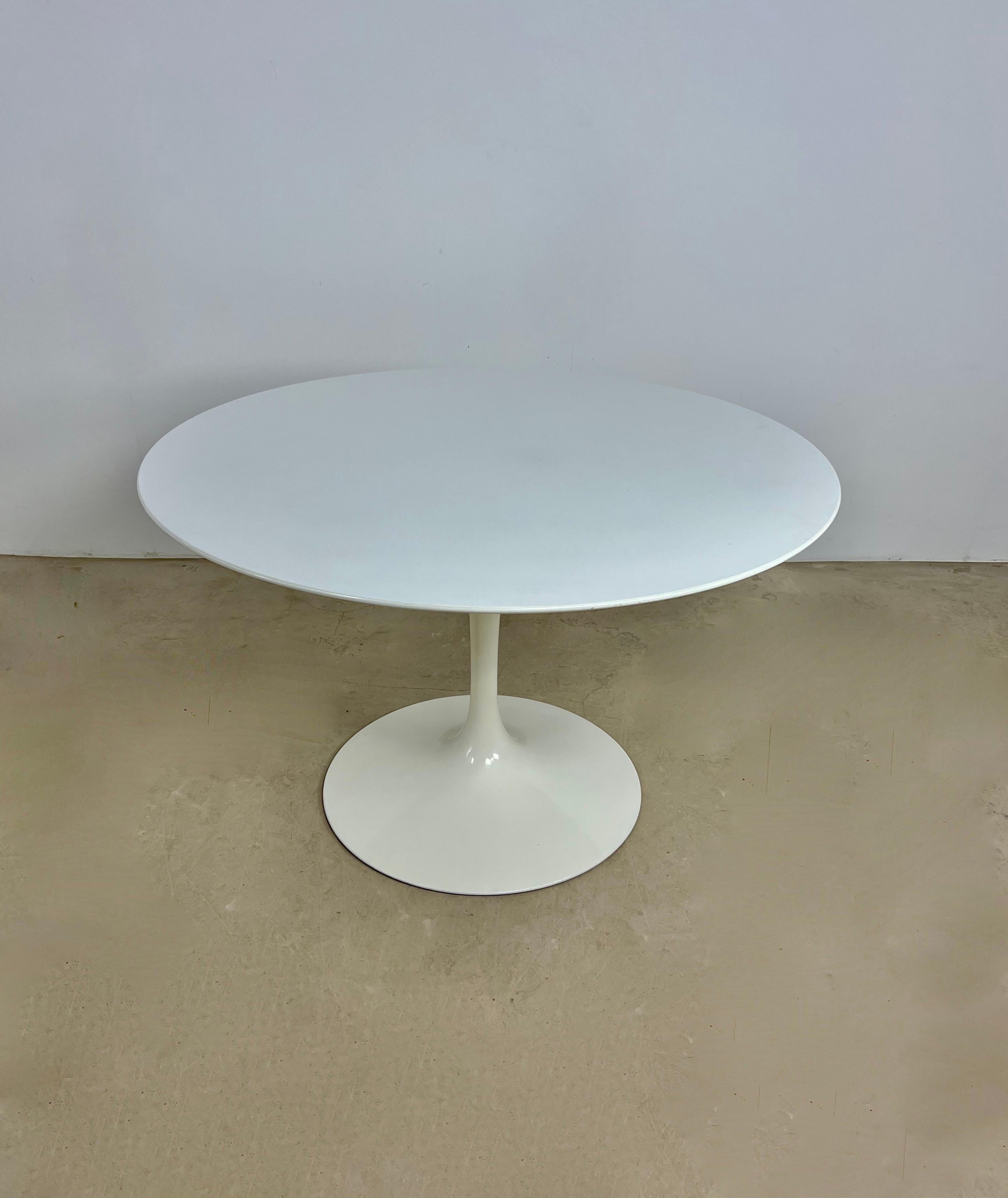 White laminated wood table. Stamped Knoll international. Wear due to time and age of the table.