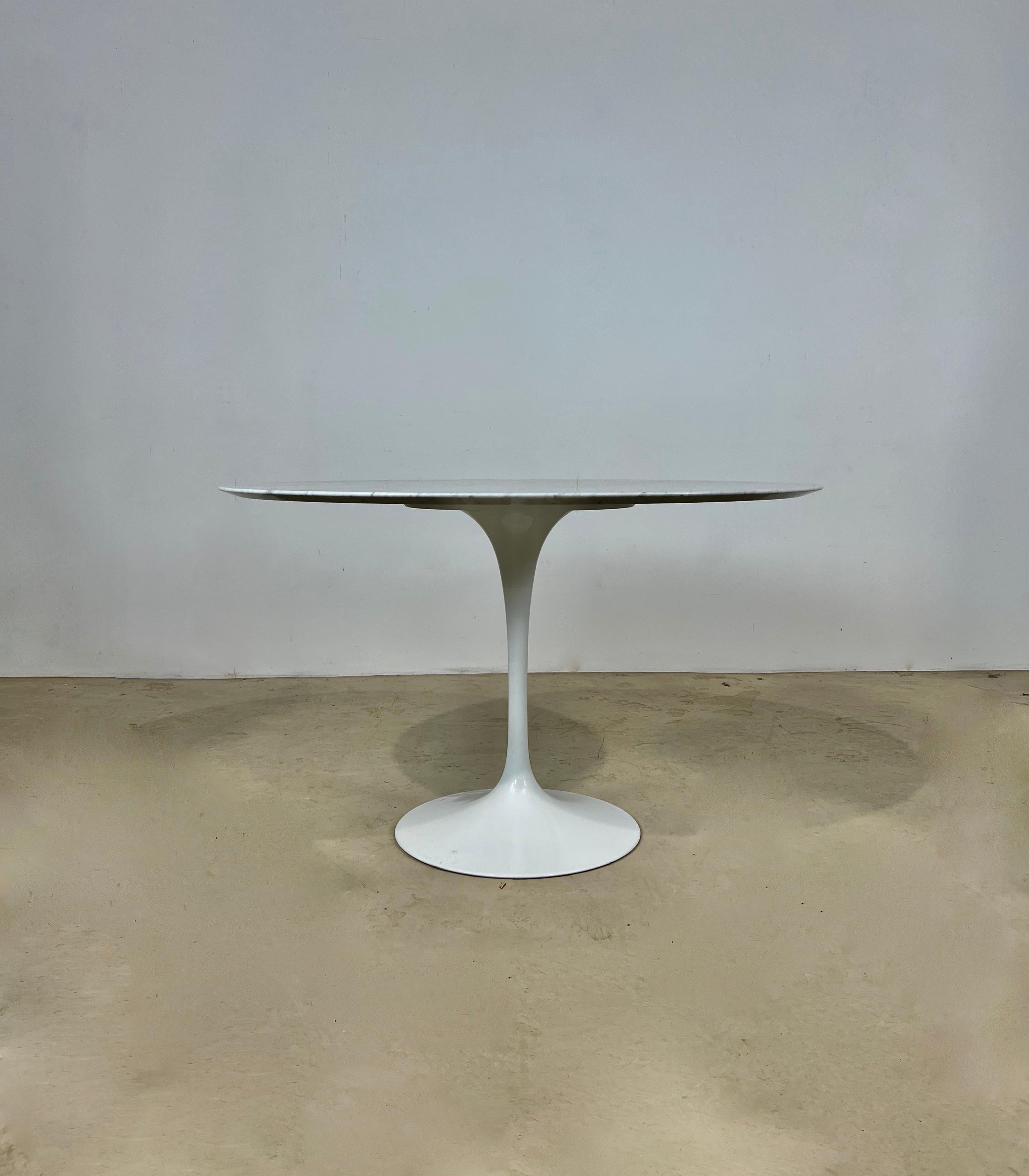 Carrara marble table. Foot stamped Knoll. Wear due to time and age of the table.