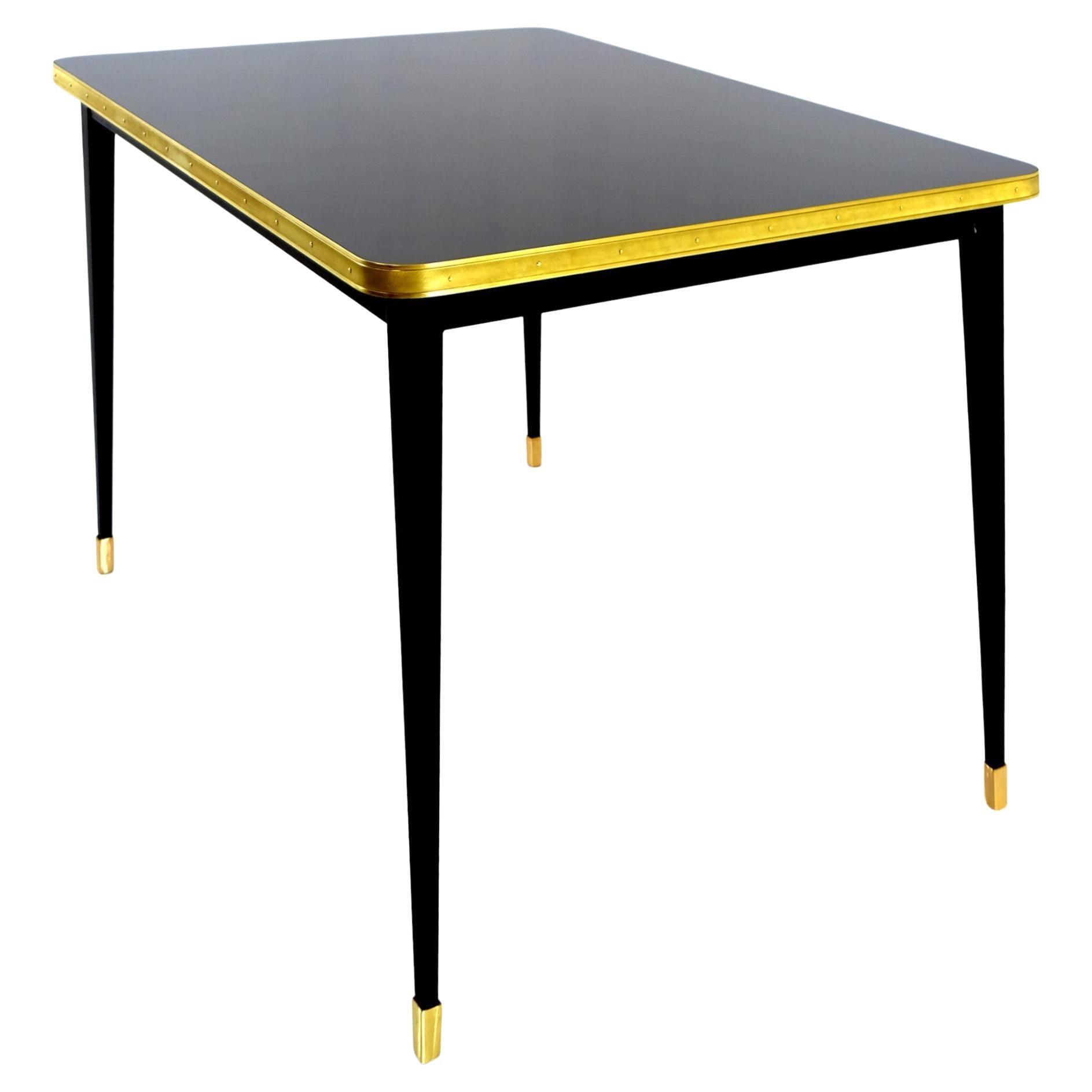 Julieta Collection. 

Table with Black Steel Conical Legs with Brass Bottom End Table Top on High Gloss Laminate Brass Tape Frame

Introducing the stunning dining room table with black powder-coated steel construction, boasting sleek conical legs