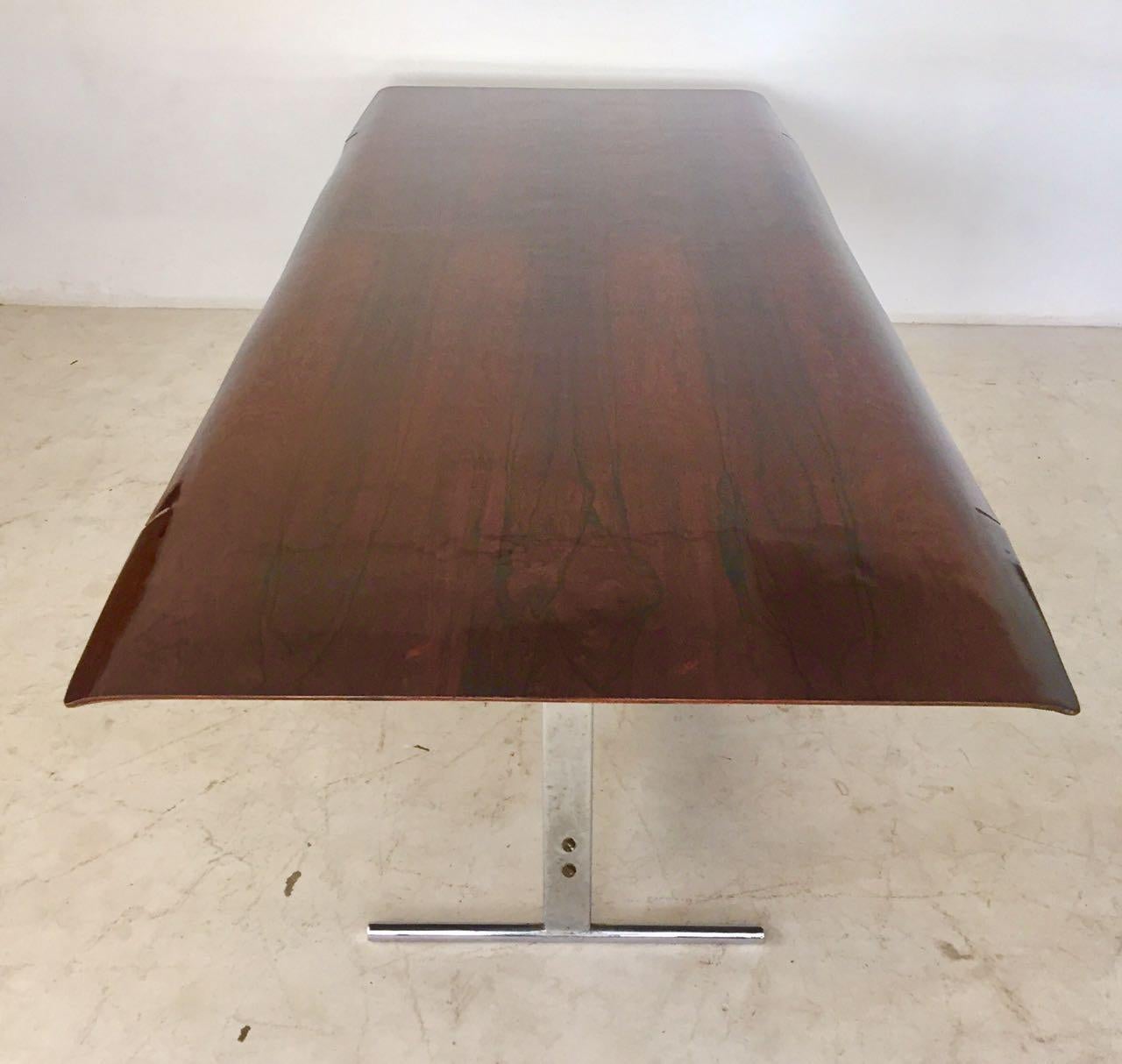 Dining table composed of a base of the 1950s. Feet made in metal with Brazilian rosewood on top. Designed by Jorge Zalszupin.
