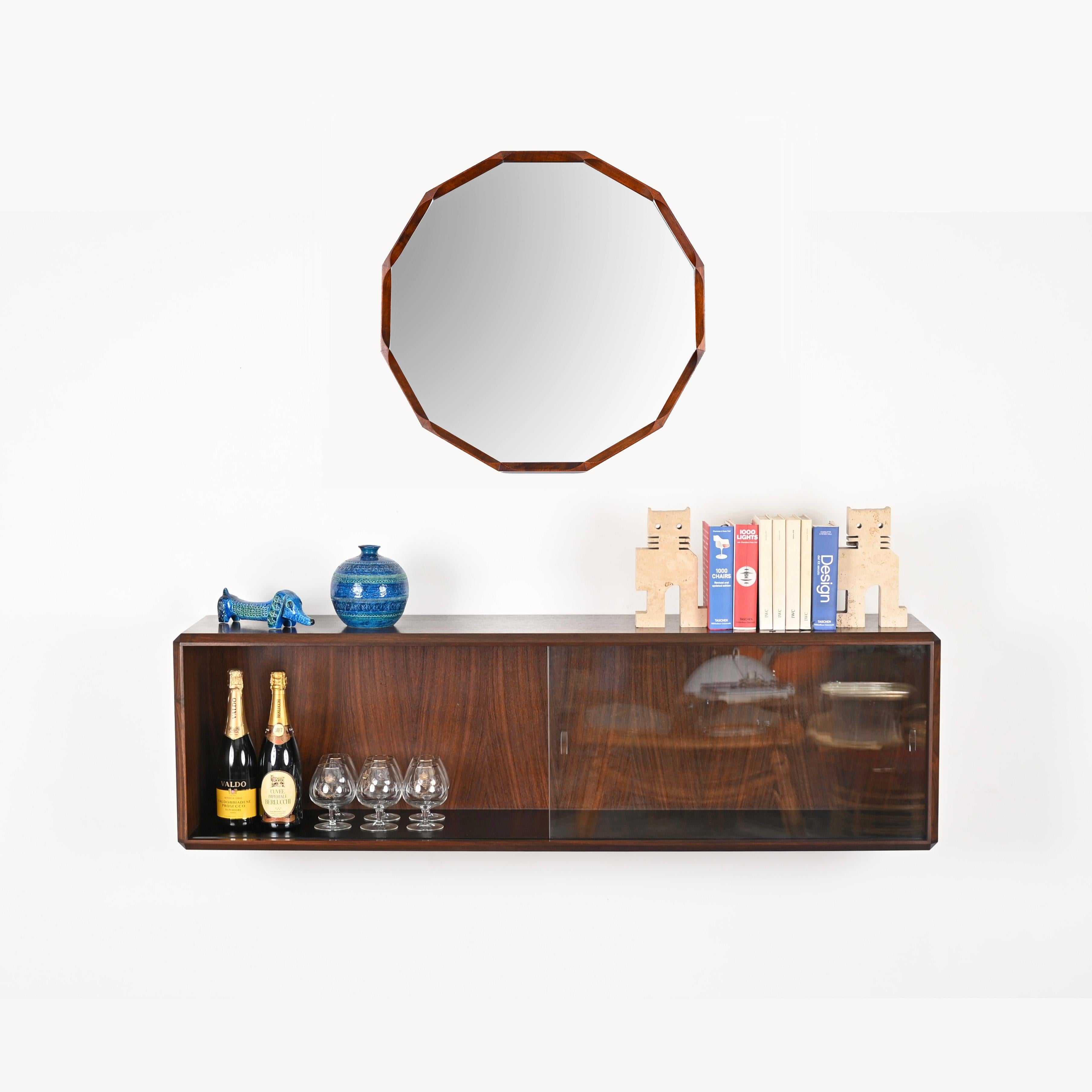 Marvellous Italian showcase in wood with sliding crystal glasses. This elegant and versatile object was designed by Dino Cavalli in Italy during the 1970s. 

The quality of the wood used on this showcase is outstanding, with marvelous grain. The
