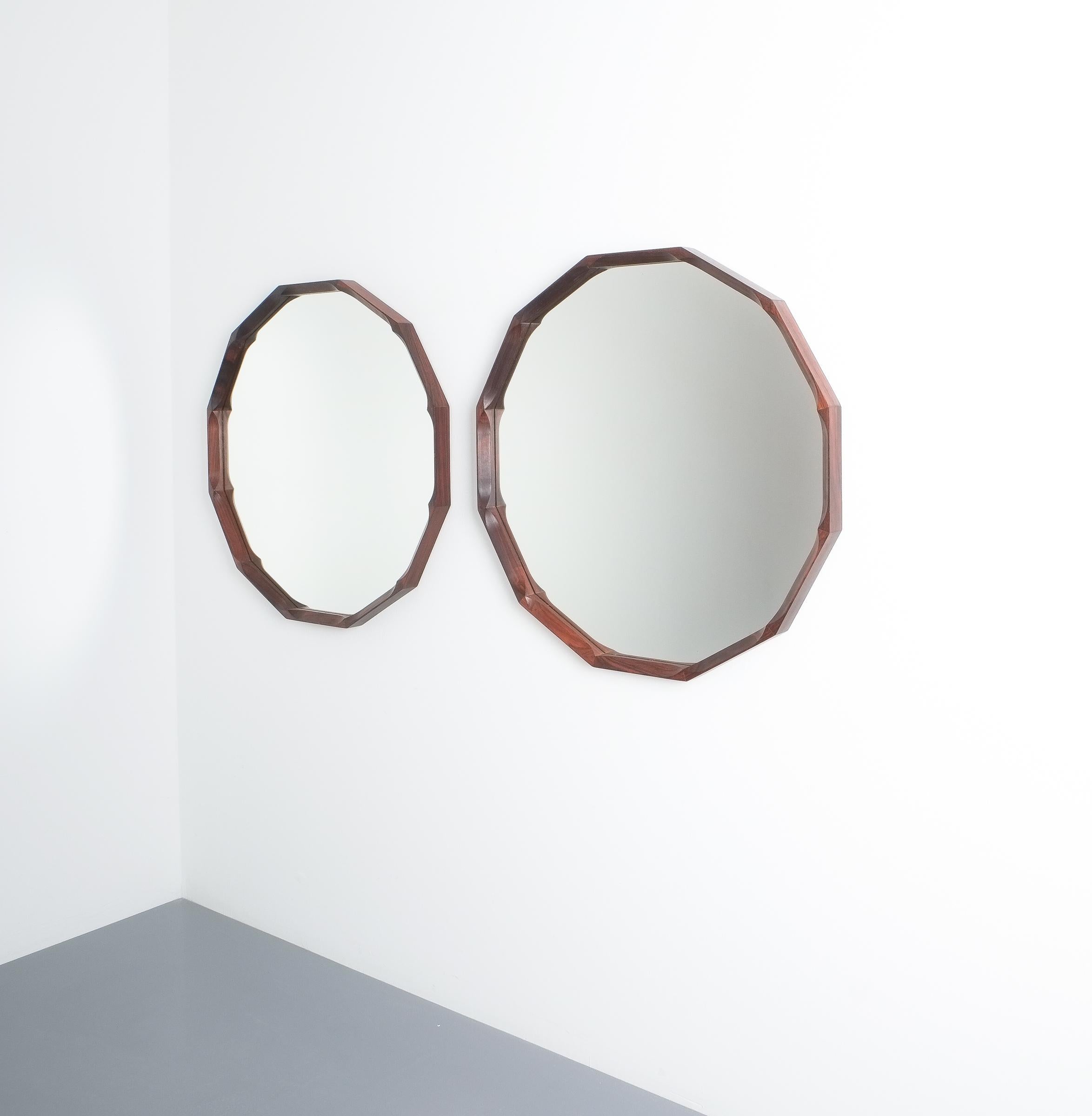 Polygonal walnut mirror by Dino Cavalli, Italy, circa 1960

Solid wooden mirror frame with a diameter of 24“ and mirror in very good condition, midcentury, Italy.
We have the same model in teak and a bit smaller one in walnut available in our