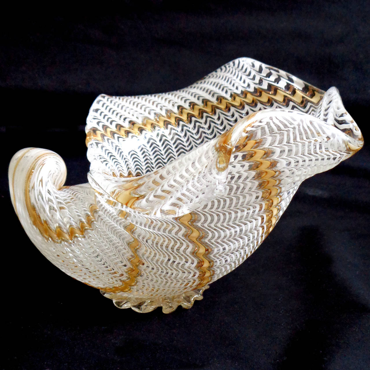 Gorgeous vintage Murano hand blown white, yellow orange and aventurine Italian art glass seashell bowl. Documented to designer Dino Martens for Aureliano Toso, circa 1950s, in the 