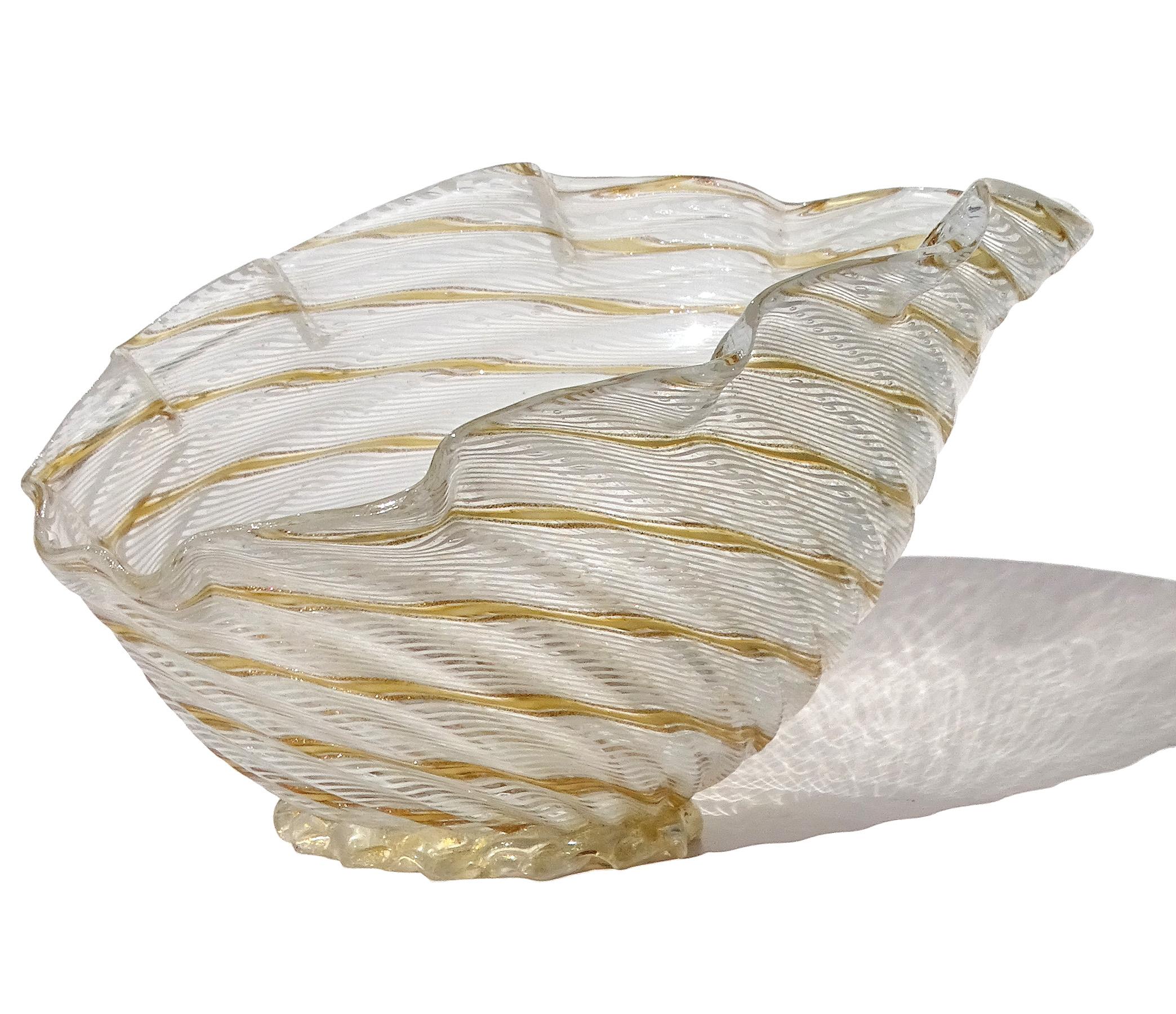 Beautiful vintage Murano hand blown white, with orange and aventurine flecks Italian art glass seashell bowl / dish. Documented to designer Dino Martens for Aureliano Toso, circa 1950s. Published sample is pictured in the company book (see 3rd