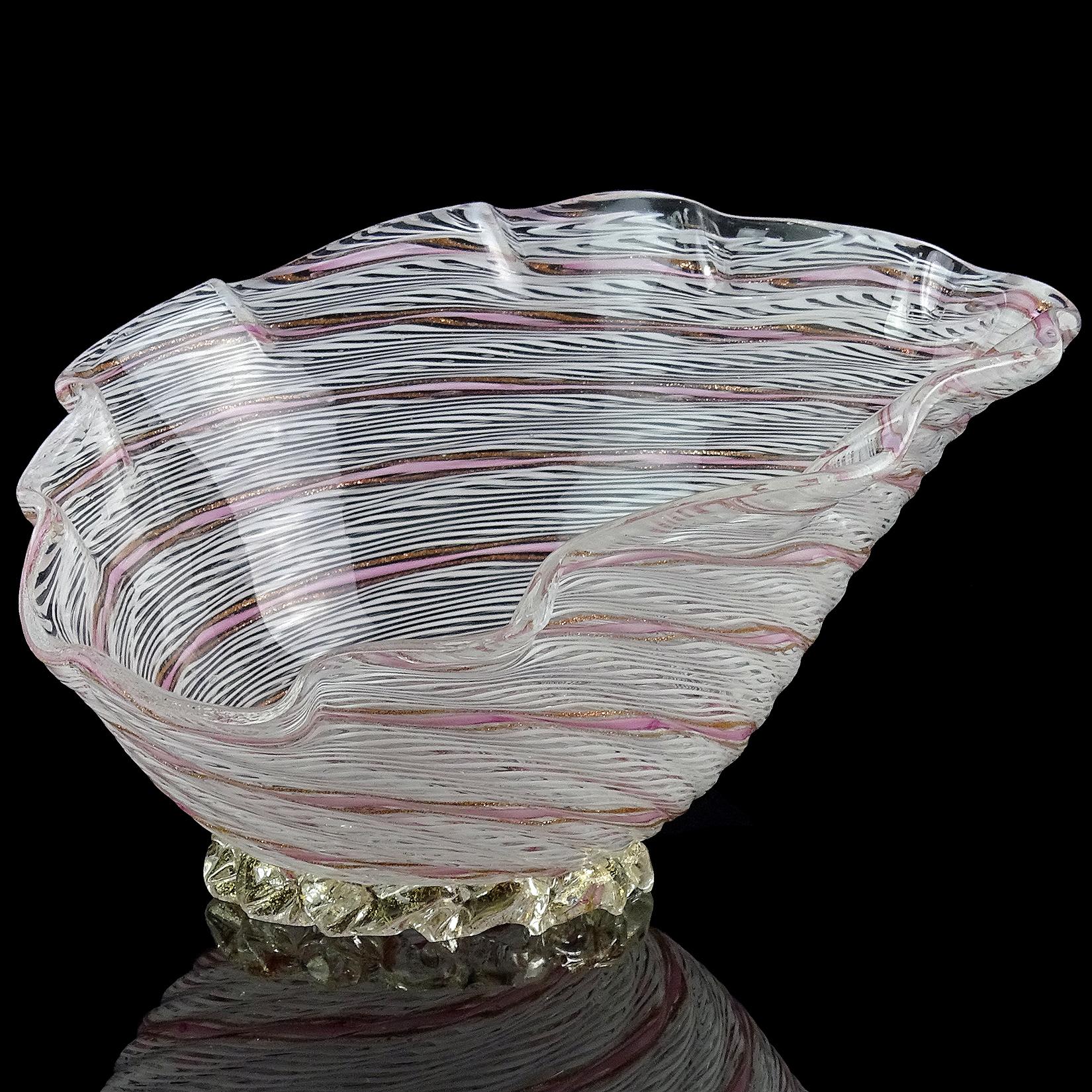 Beautiful vintage Murano hand blown white, with pink and aventurine flecks Italian art glass seashell bowl / dish. Documented to designer Dino Martens for Aureliano Toso, circa 1950s. Published in the designers book. The bowl is crated with twisting