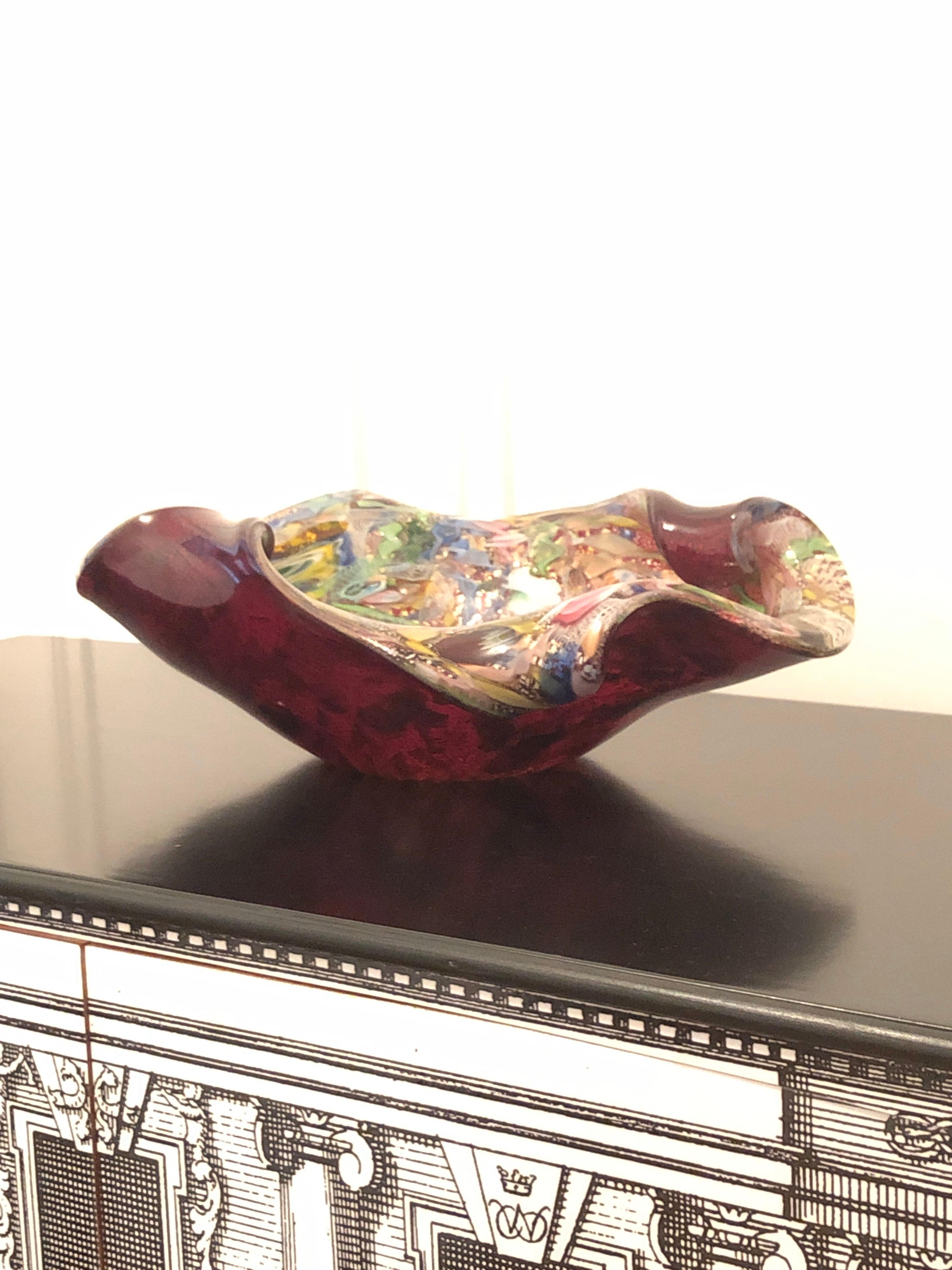 Dino Martens multicolored Murano freeform glass bowl - vide poche Murrine Murano
Born in Venice in 1894, Dino Martens studied painting and design at the Accademia di Belle Art in Rome. A talented artist, his paintings were exhibited at the Venice