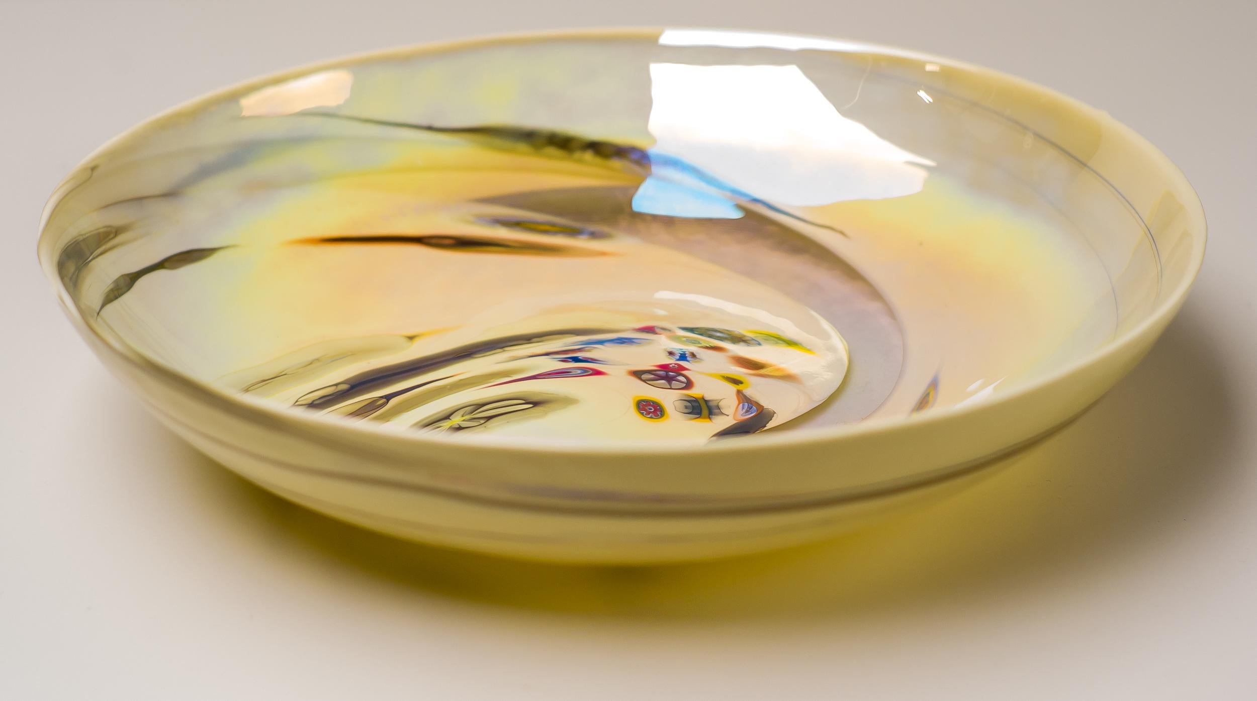 Impressive large bowl made of spiraling clear and colored glass and colorful murrines.
Engraved; Dino Martens, A. Toso, Murano.

Born in Venice in 1894, Dino Martens studied painting and design at the Accademia di Belle Art in Rome. A talented