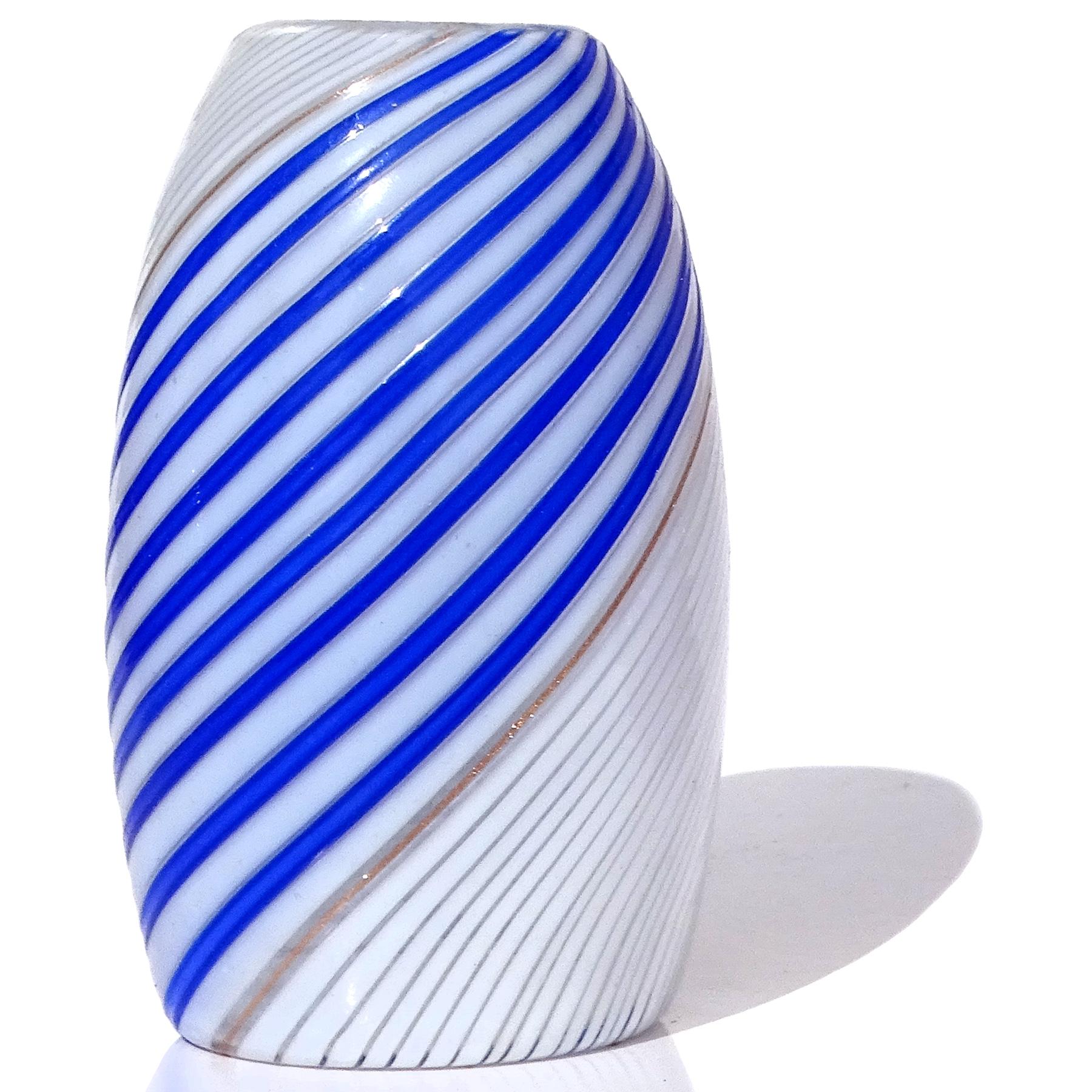 Beautiful vintage Murano hand blown white and sapphire blue ribbons Italian art glass small flower bud vase. Documented to designer Dino Martens for the Aureliano Toso workshop circa 1950s. The published design is in many books and catalogs. The