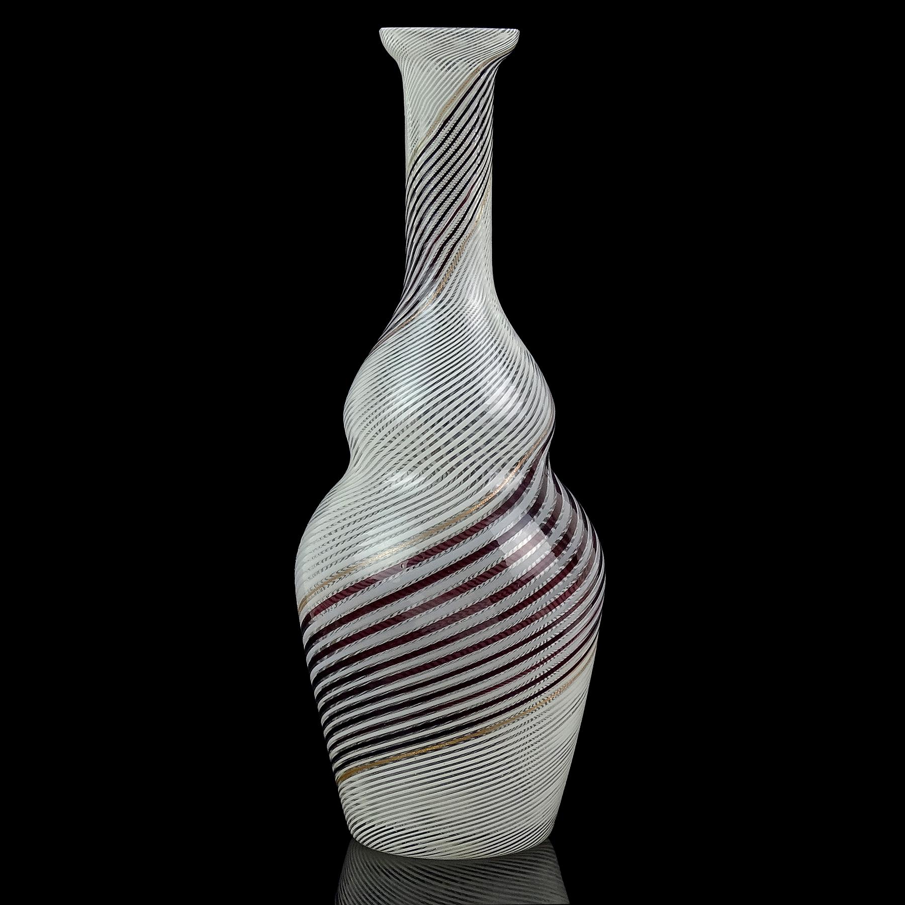 Beautiful vintage Murano hand blown black and white ribbons Italian art glass cupped rim flower vase. Documented to master designer Dino Martens for the Aureliano Toso workshop circa 1950s. Published design is in many books and catalogs. The vase