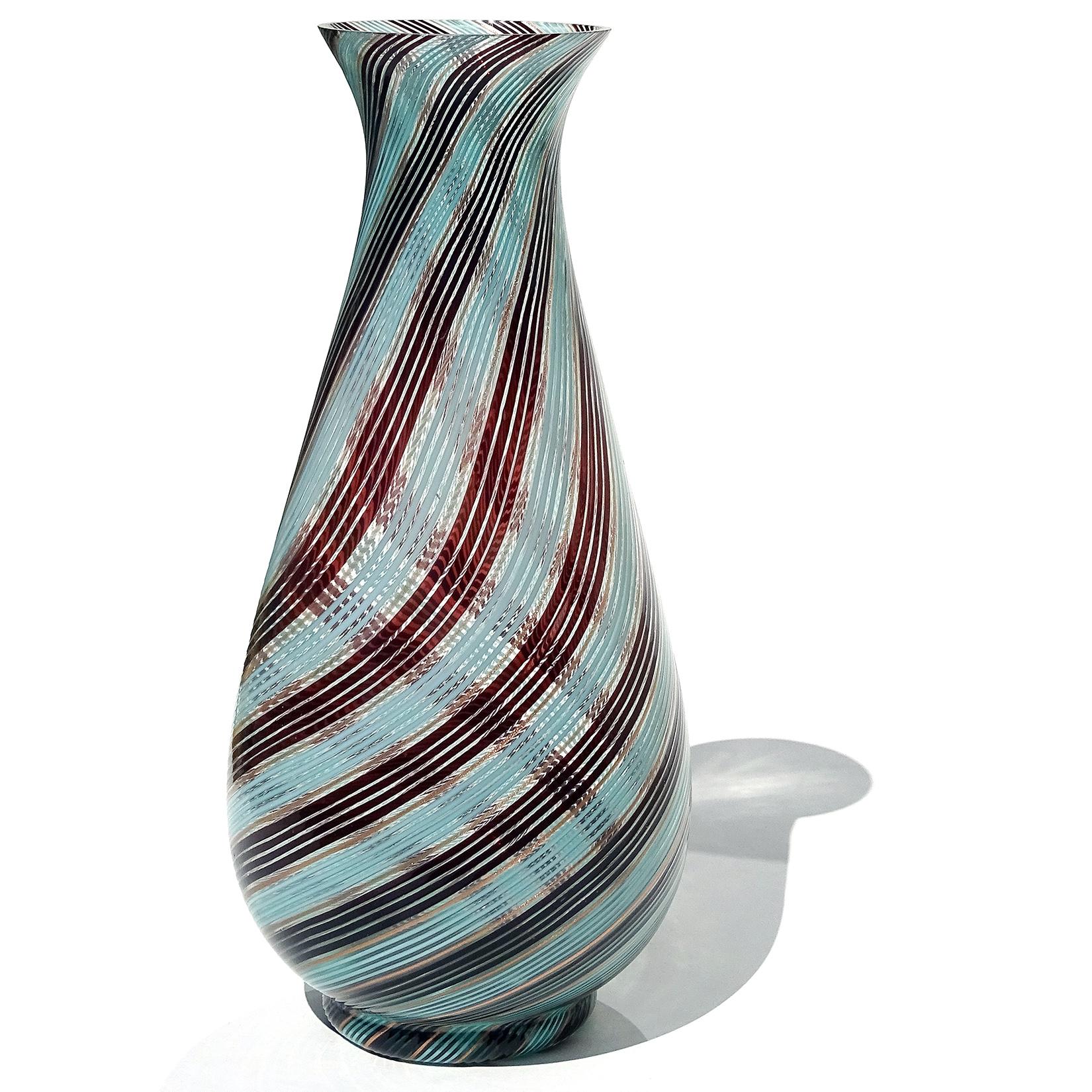 Beautiful, and very large vintage Murano hand blown light blue, black and copper aventurine flecks filigrana ribbons Italian art glass flower vase. Documented to designer Dino Martens for Aureliano Toso, in the 
