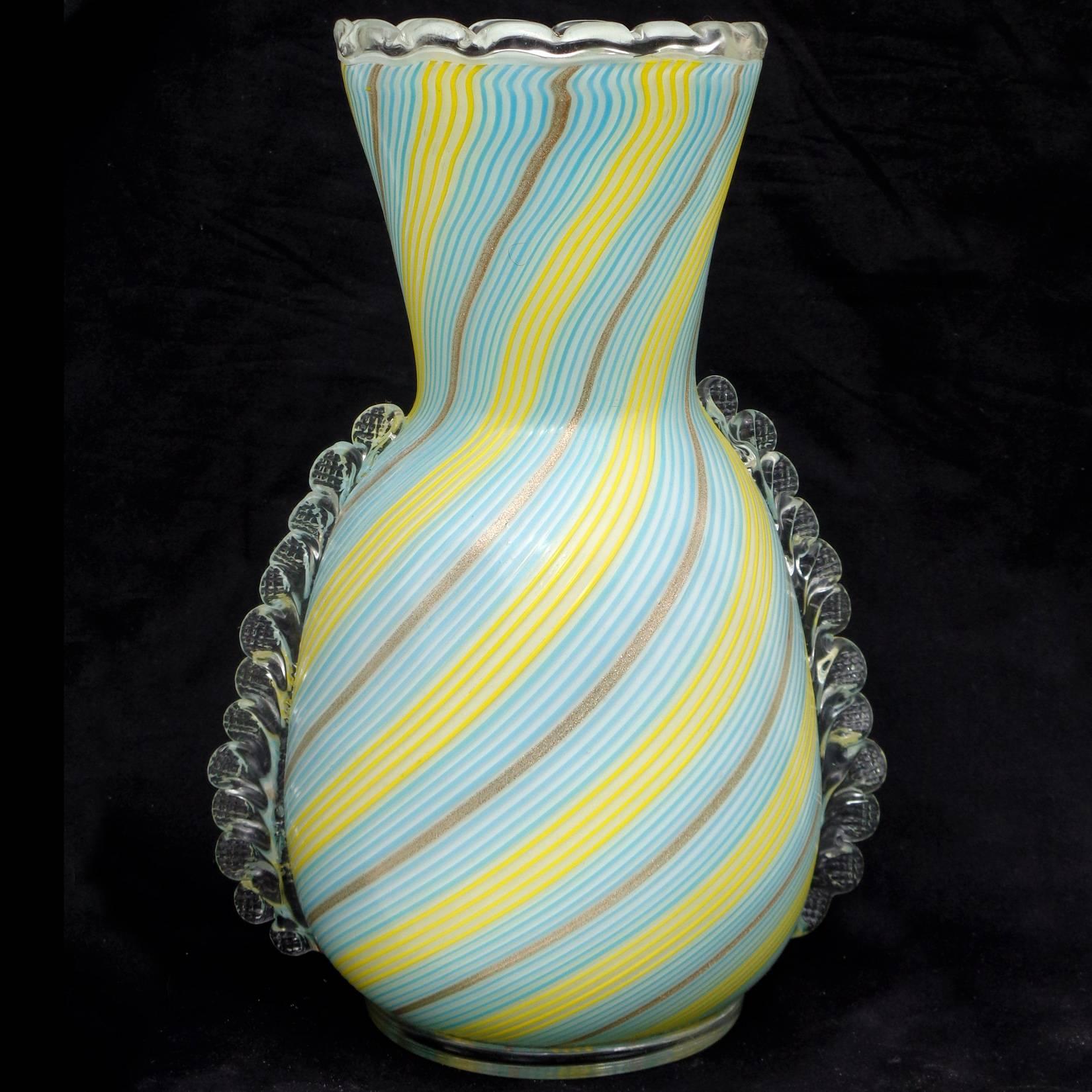 Beautiful large vintage Murano hand blown yellow, blue and aventurine ribbons over white, art glass flower vase. Created by designer Dino Martens for Aureliano Toso. It has clear glass applications on the side and rim, with circular ring on the