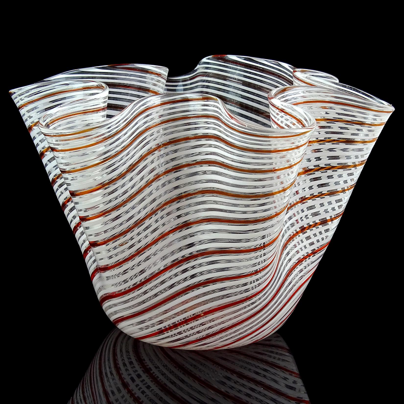 Beautiful Murano hand blown red orange and white Filigrana ribbons Italian art glass Fazzoletto handkerchief vase. Documented to designer Dino Martens for Aureliano Toso. Measures: 7 1/2