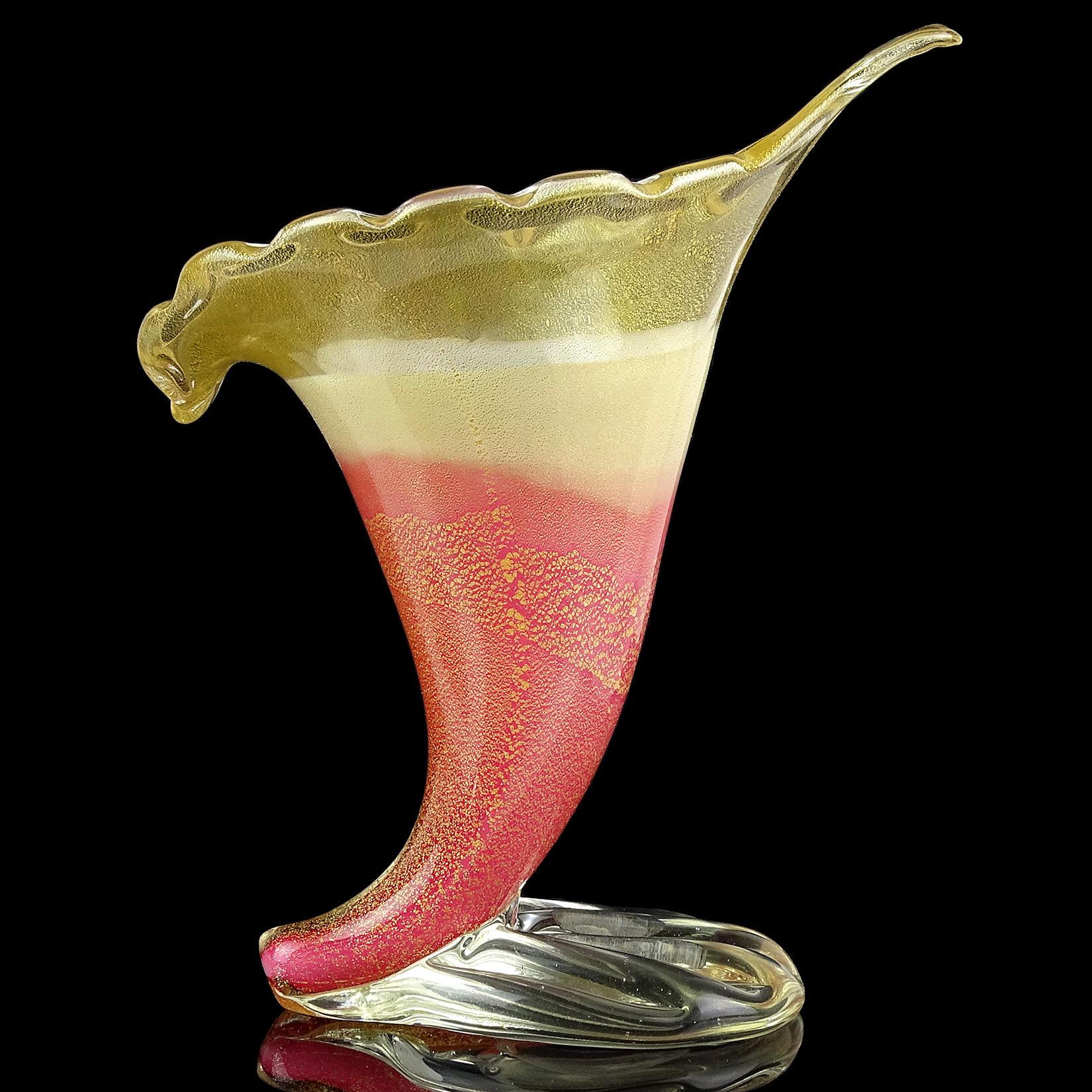 Gorgeous vintage Murano hand blown pink, white and gold flecks Italian art glass flower vase. Documented to designer Dino Martens for Aureliano Toso, circa 1954, model number 5669 (published). The piece has a lower pink layer, followed by a white