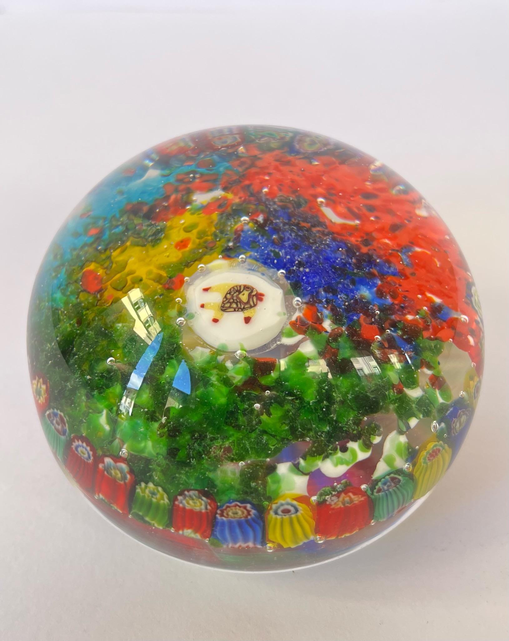 Very rare Presse Papier of Dino Martens 1950, with murrine inside and a murrine of a stylized fish in the central part.
This eye-catching presse papier is full of details. The interior part is in shades of a multicolor murrine with a spectacular