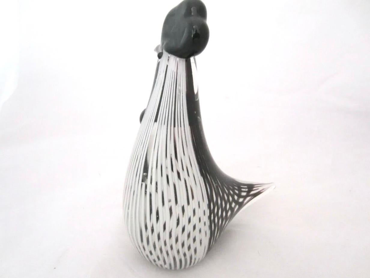 Gorgeous vintage Murano Art Glass rooster by Dino Martens, trademark black on white striped central mass with stylized black glass beak and crown. Gorgeous midcentury piece with a sense of humor.
  